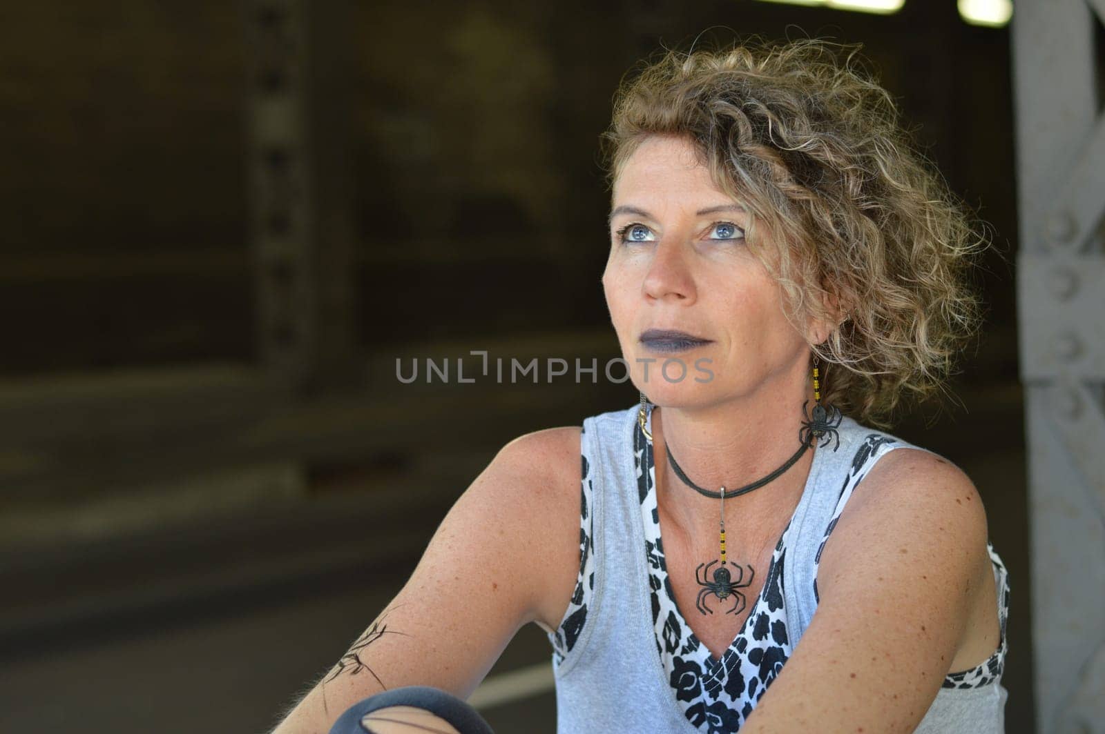 Middle-aged punk looks up hopefully and expectantly