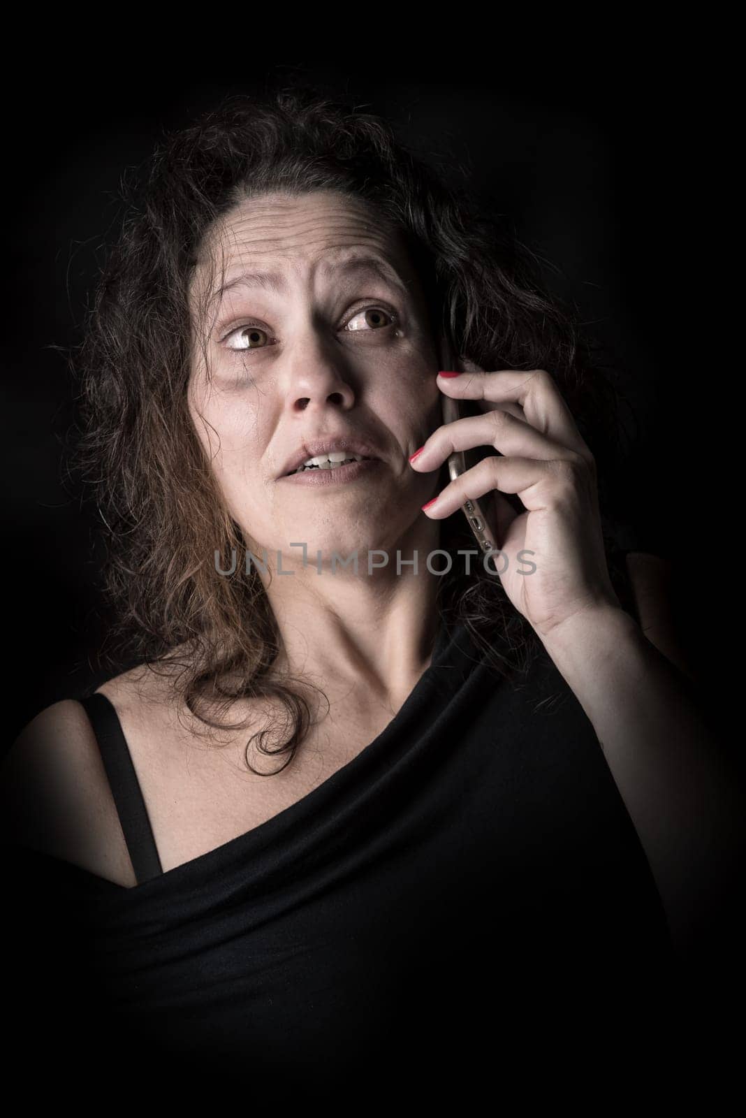 Abused woman victim of domestic violence, calling for help