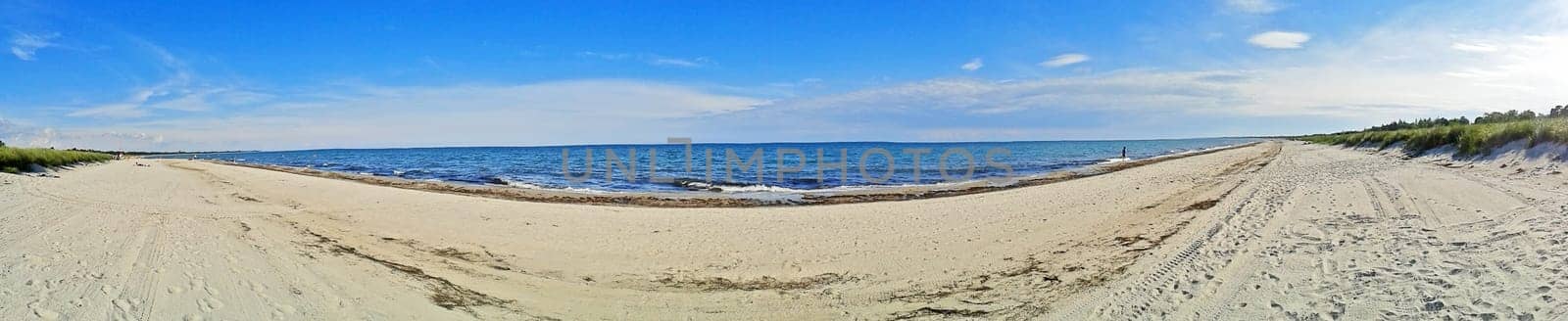 Panorama of Marielyst beach, denmark with ocean baltic sea and blue sky