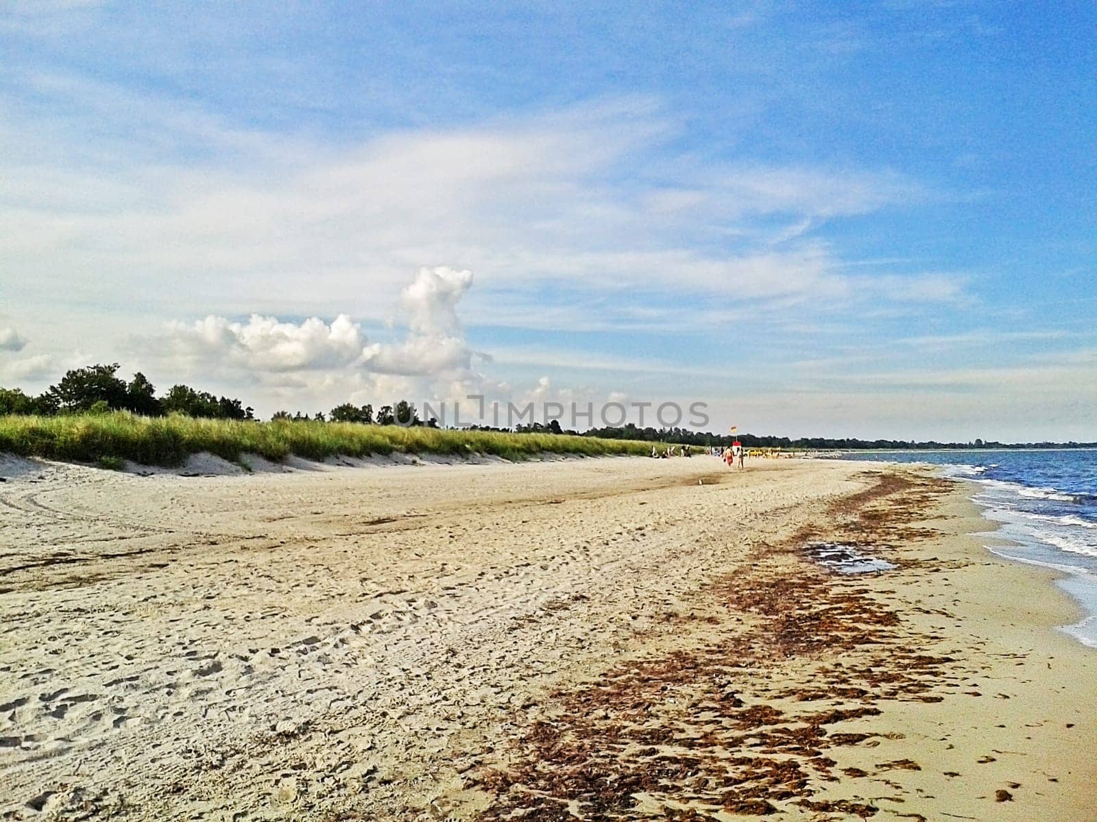 Beach in Marielyst, denmark with ocean baltic sea and blue sky