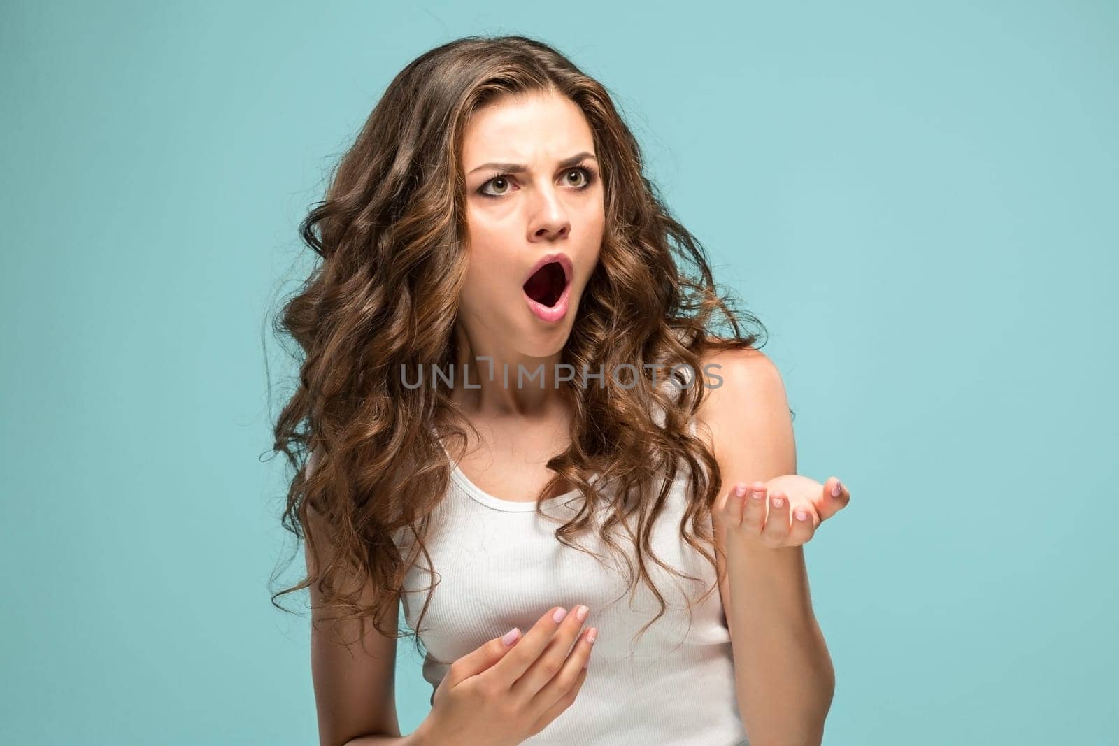 The portrait of Fright young woman with shocked facial expression