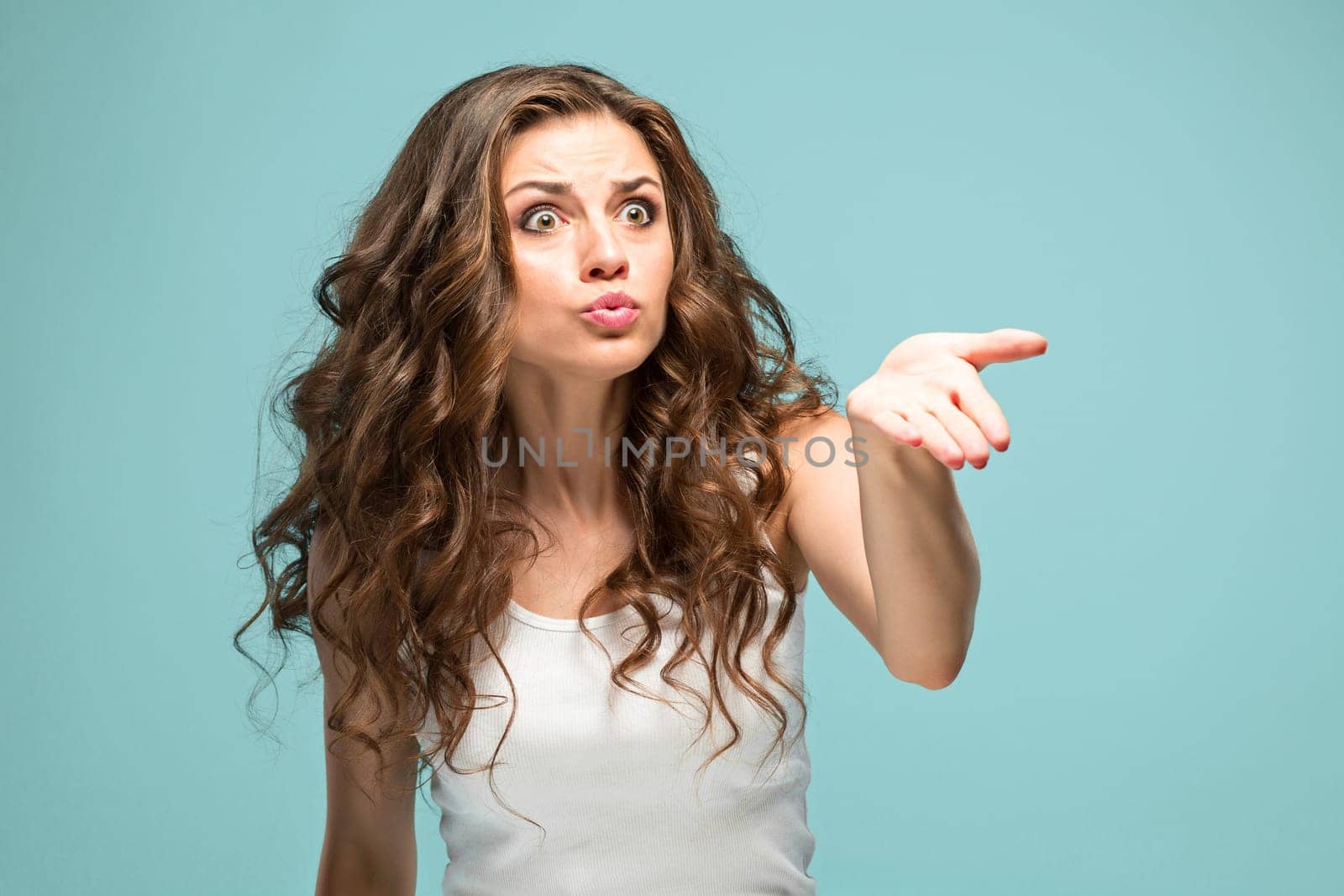 The portrait of Fright young woman with shocked facial expression