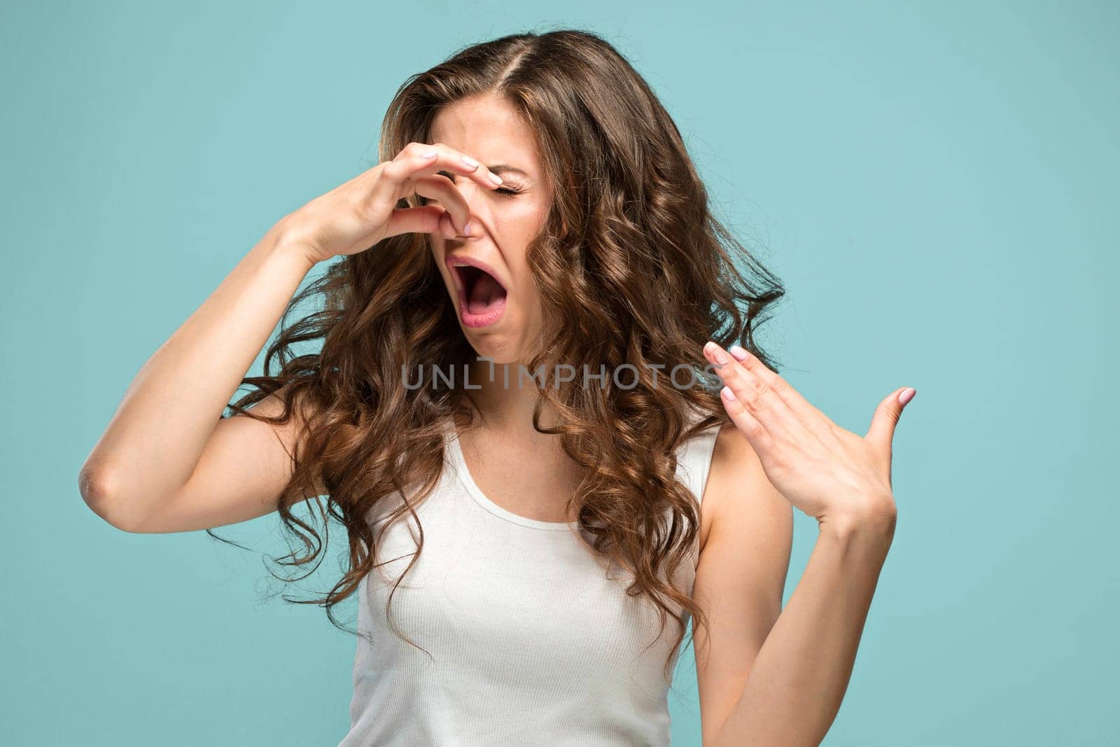 The portrait of disgusted woman on studio background