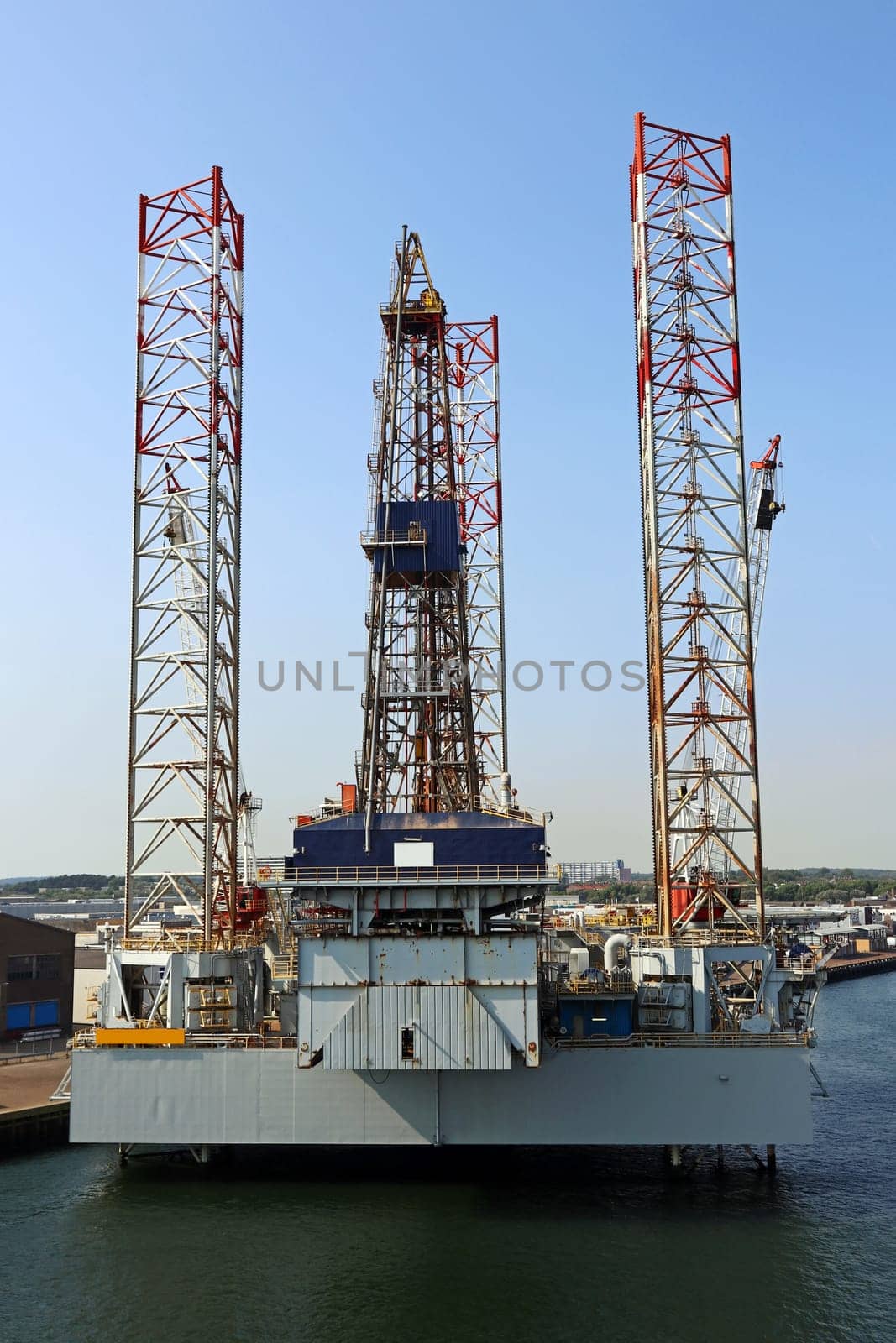 An oil platform in a port by the sea. An oil rig in the sea