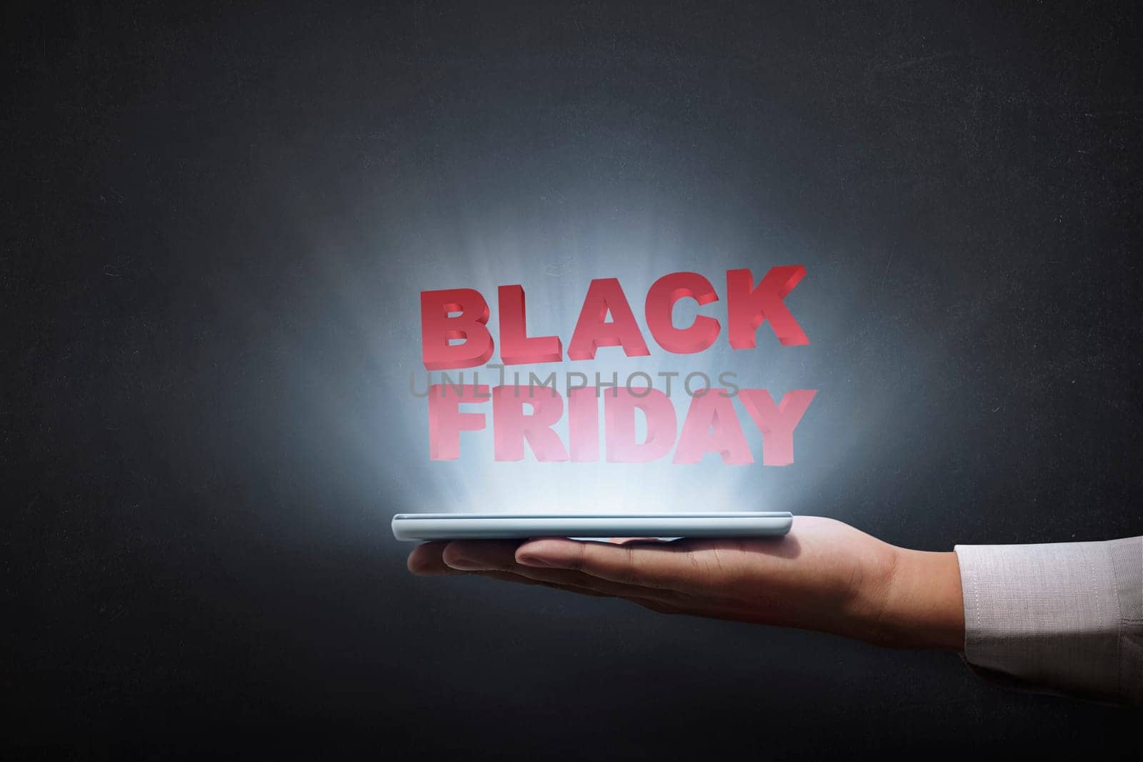 People holding tablet and showing Black Friday advert over black background