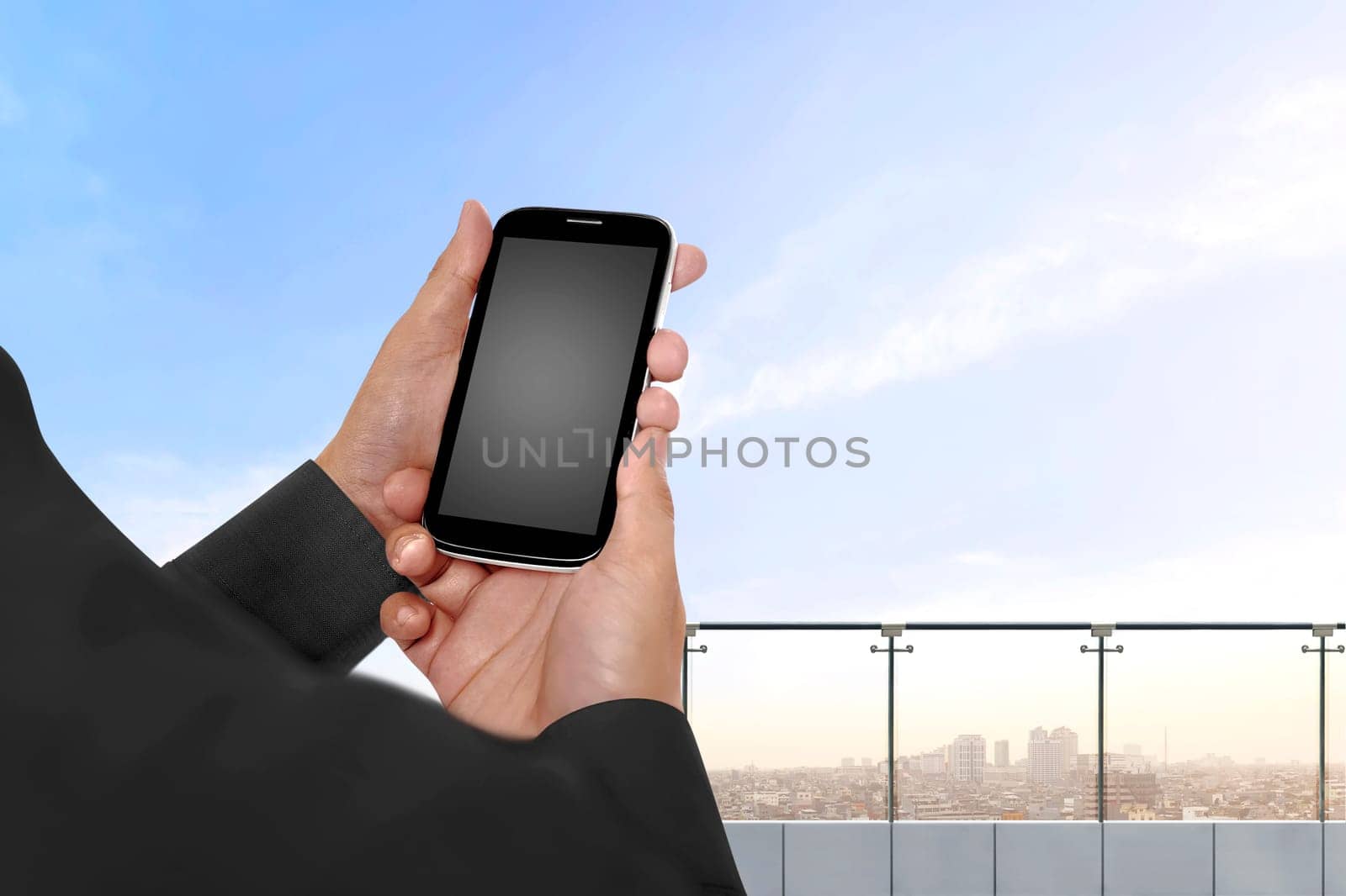 Hand holding cellphone with empty blank screen for copyspace