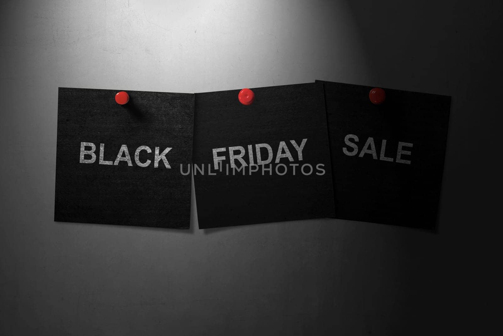 Black Friday Sale concept text written across black paper pinned on the wall