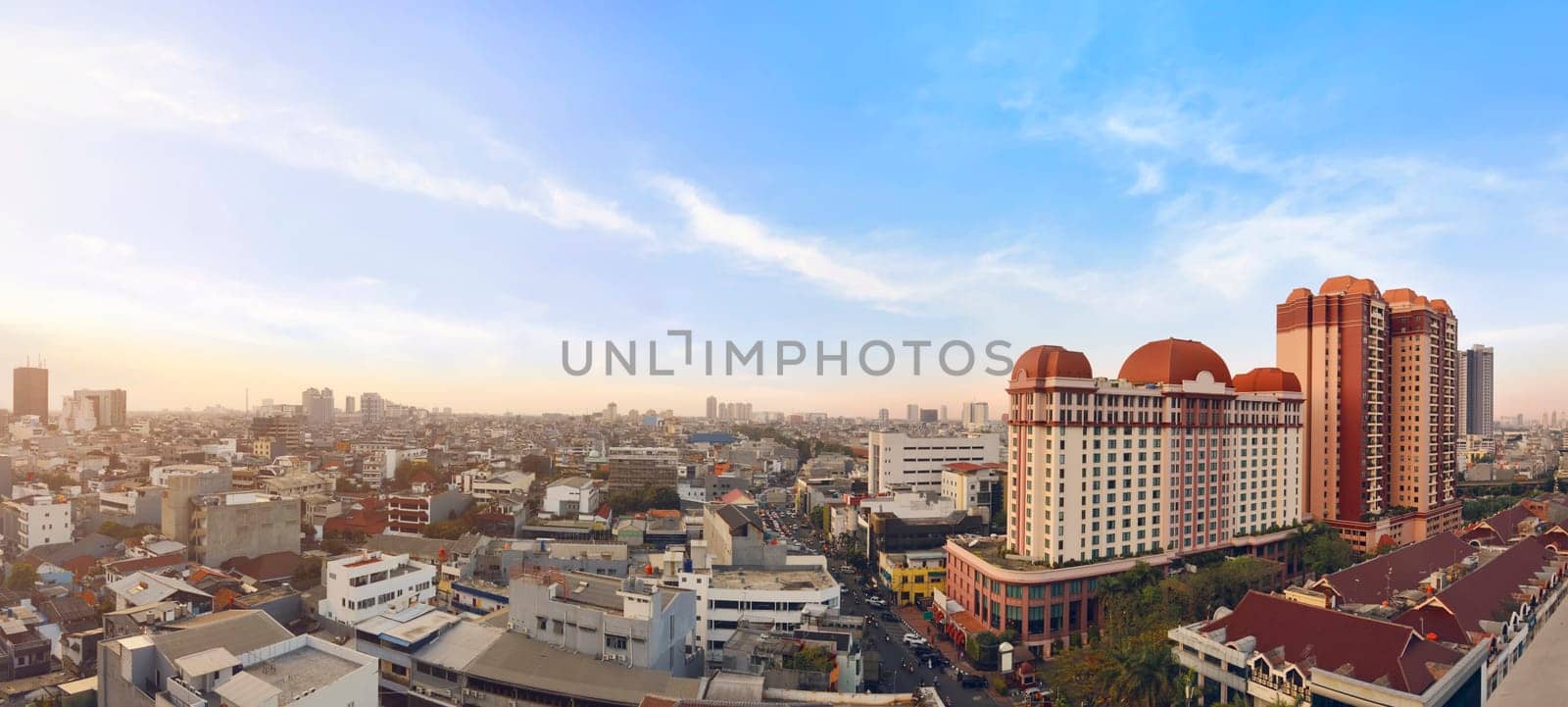 Portrait of jakarta cityscape with modern building against dramatic sky background