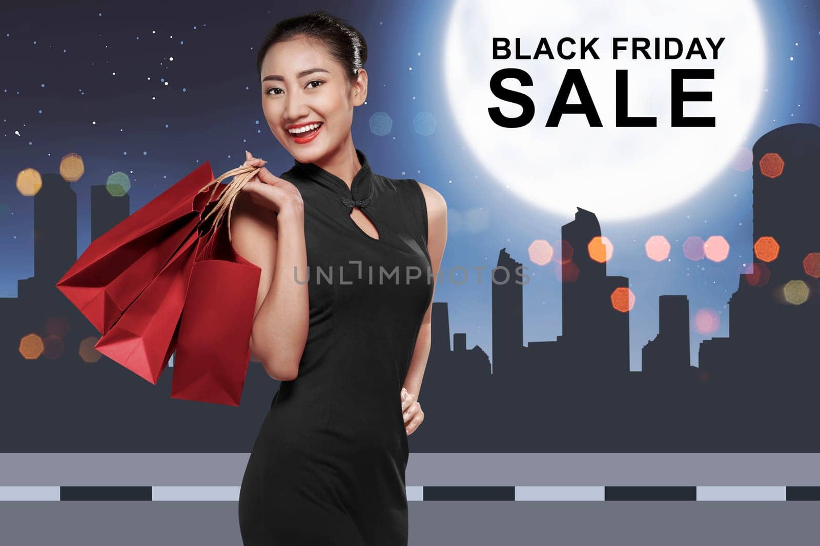 Happy asian woman with shopping bags with Black Friday message on the city