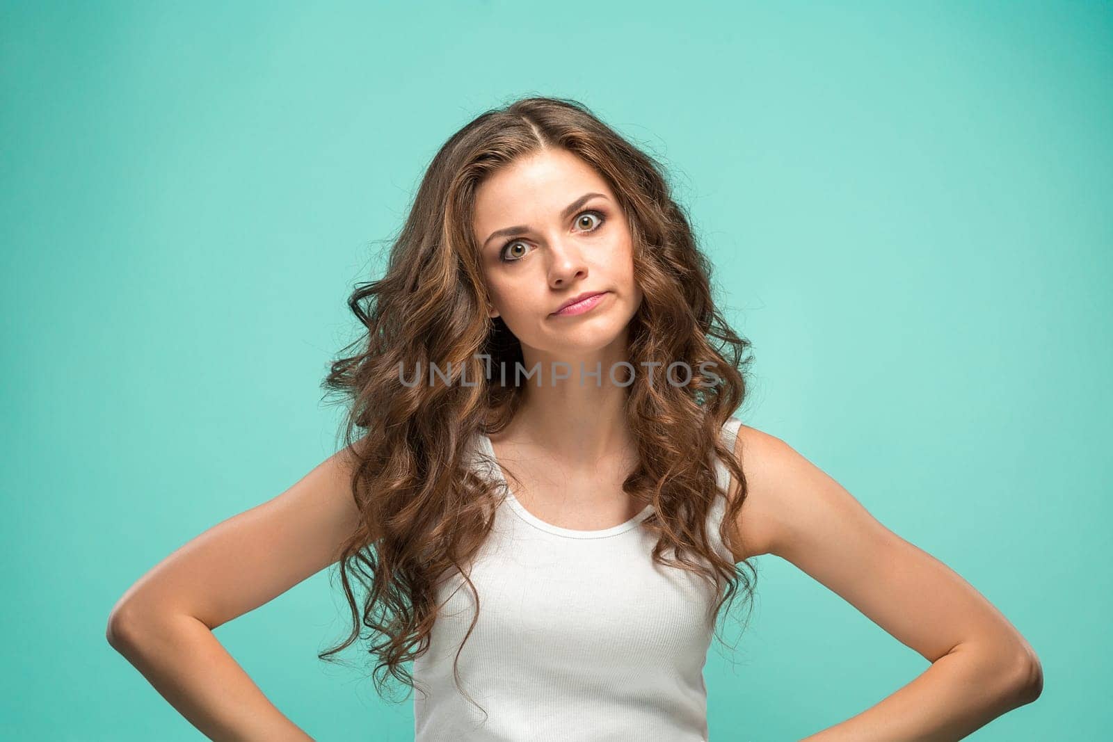 The portrait of disgusted woman on studio background