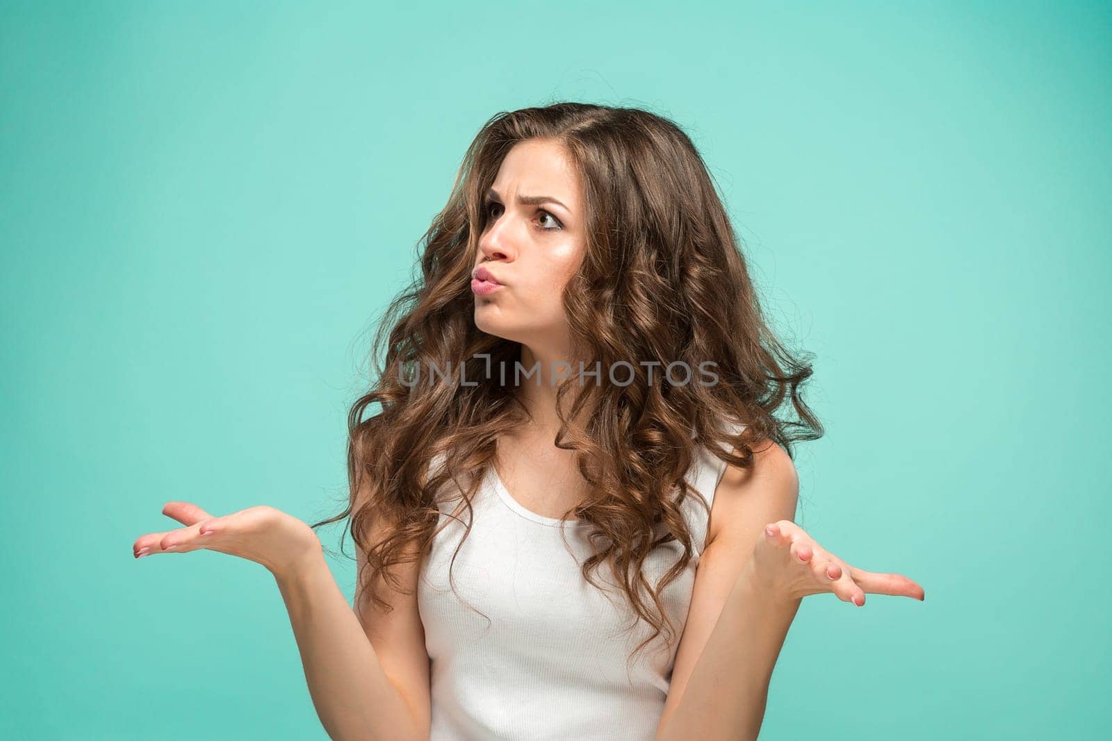 The young woman's portrait with sad emotions at studio