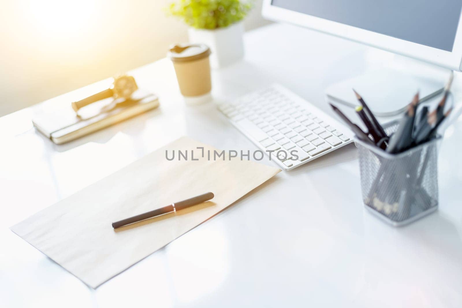 The tipical office desktop with pc, pens, notebook, laptop