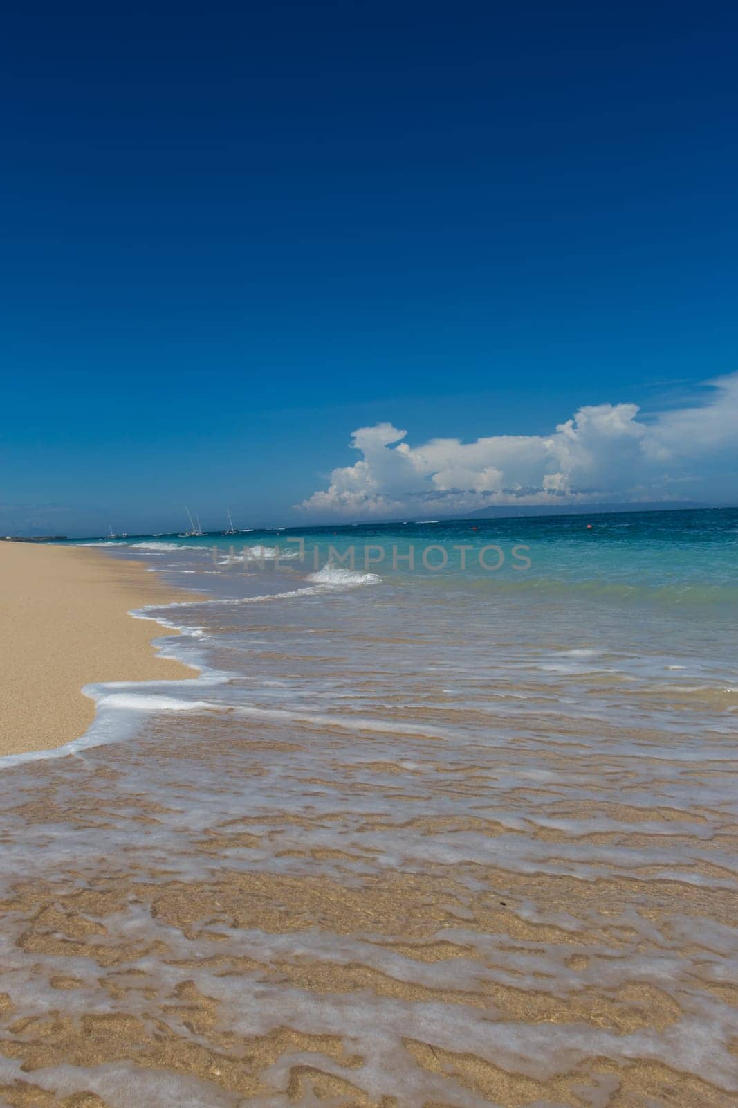 Beautiful secluded sandy beach in the Caribbean with white sand and blue sky as in paradise