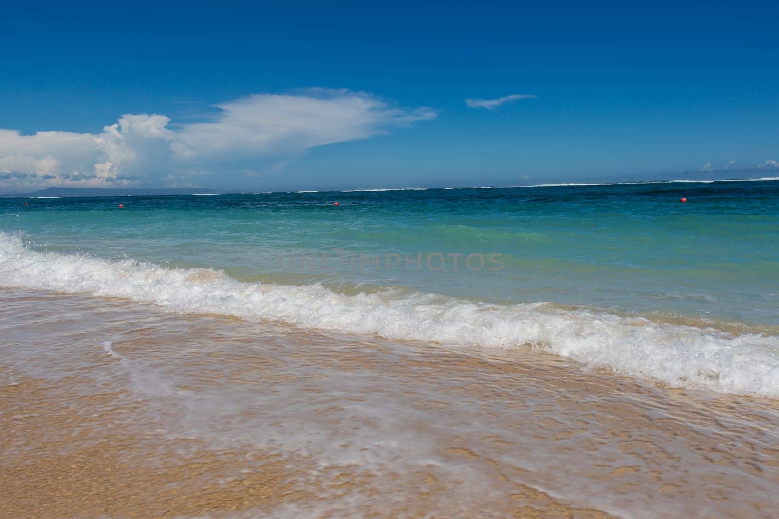 Beautiful secluded sandy beach in the Caribbean with white sand and blue sky as in paradise