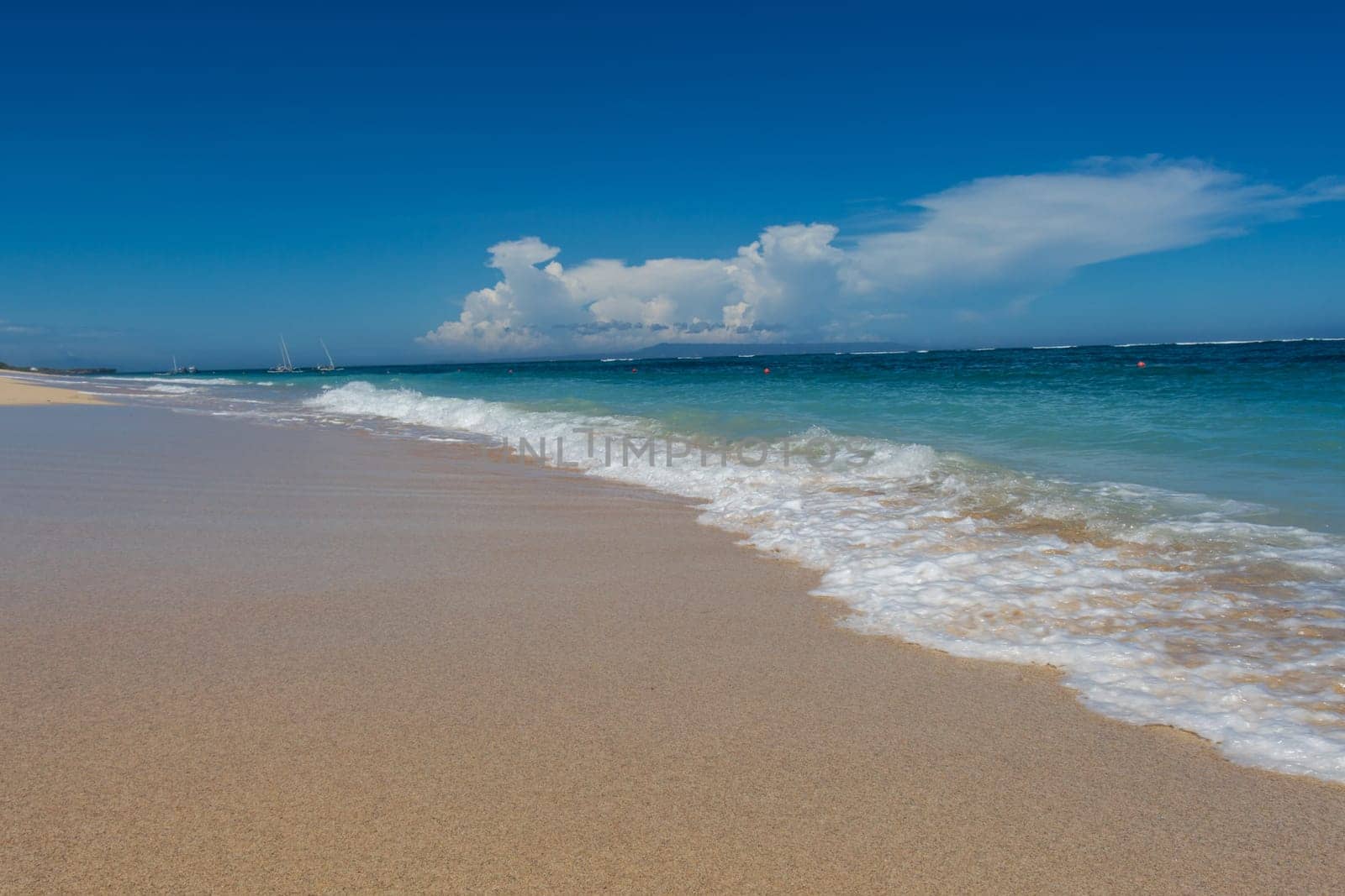 Beautiful secluded sandy beach in the Caribbean with white sand and blue sky as in paradise