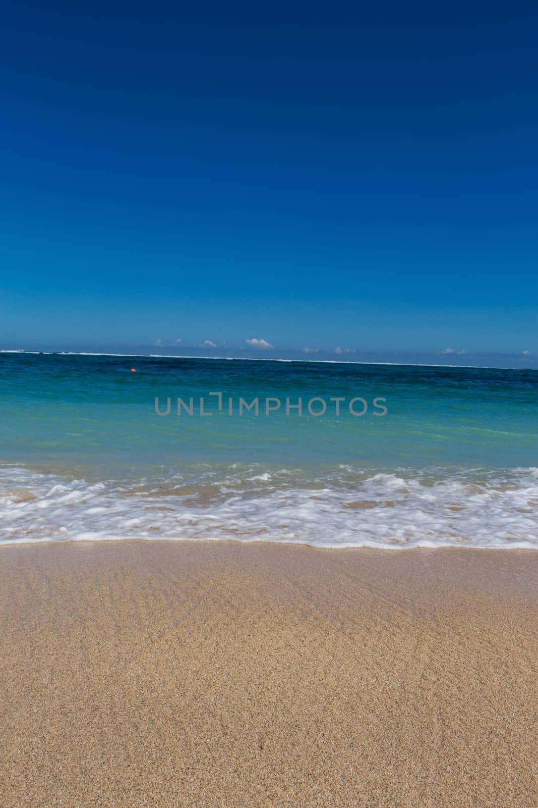 Beautiful secluded sandy beach in the Caribbean with white sand and blue sky as in paradise
