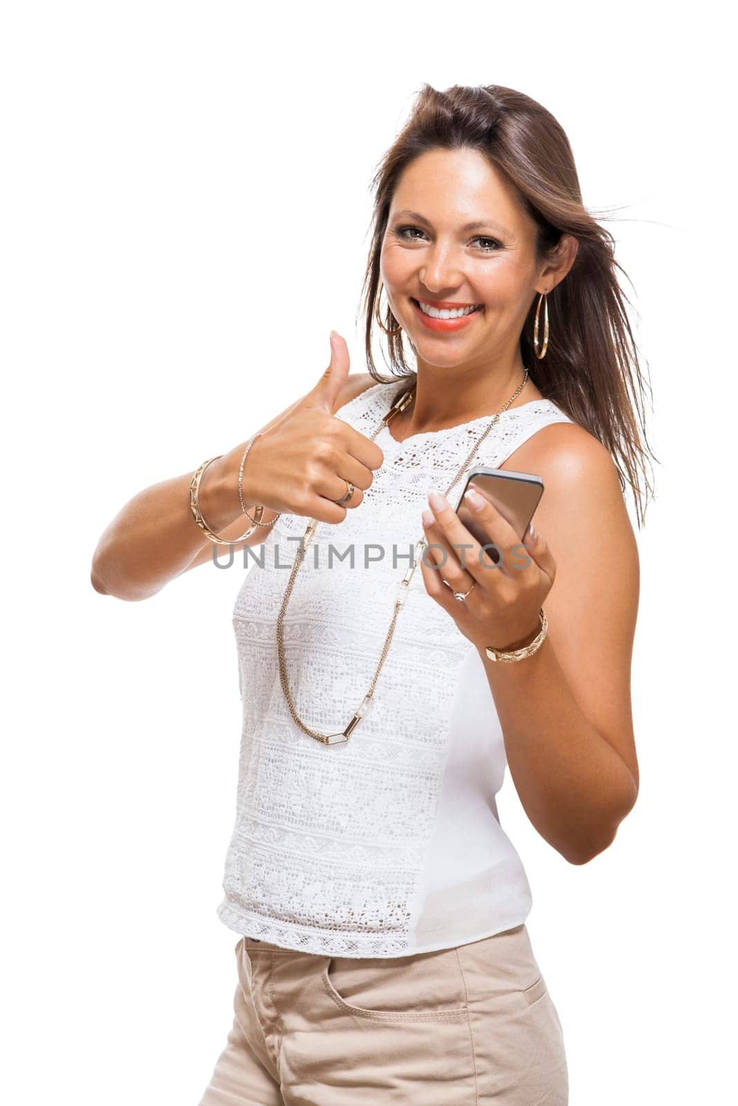Young attractive woman reacts to a text message on her phone smartphone with open dark hair with text clearance isolated freeholder