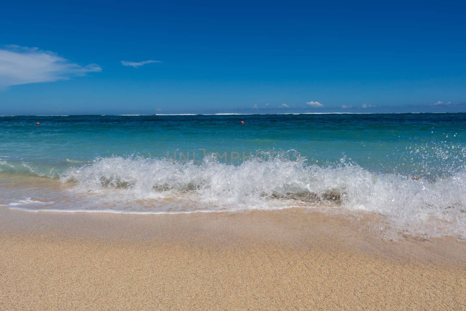 Beautiful secluded sandy beach in the Caribbean with white sand and blue sky as in paradise