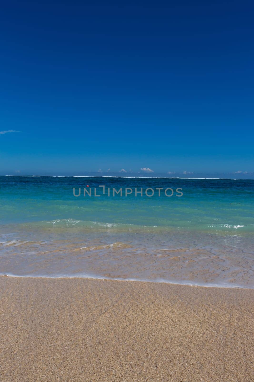 Beautiful secluded sandy beach in the Caribbean with white sand and blue sky as in paradise
