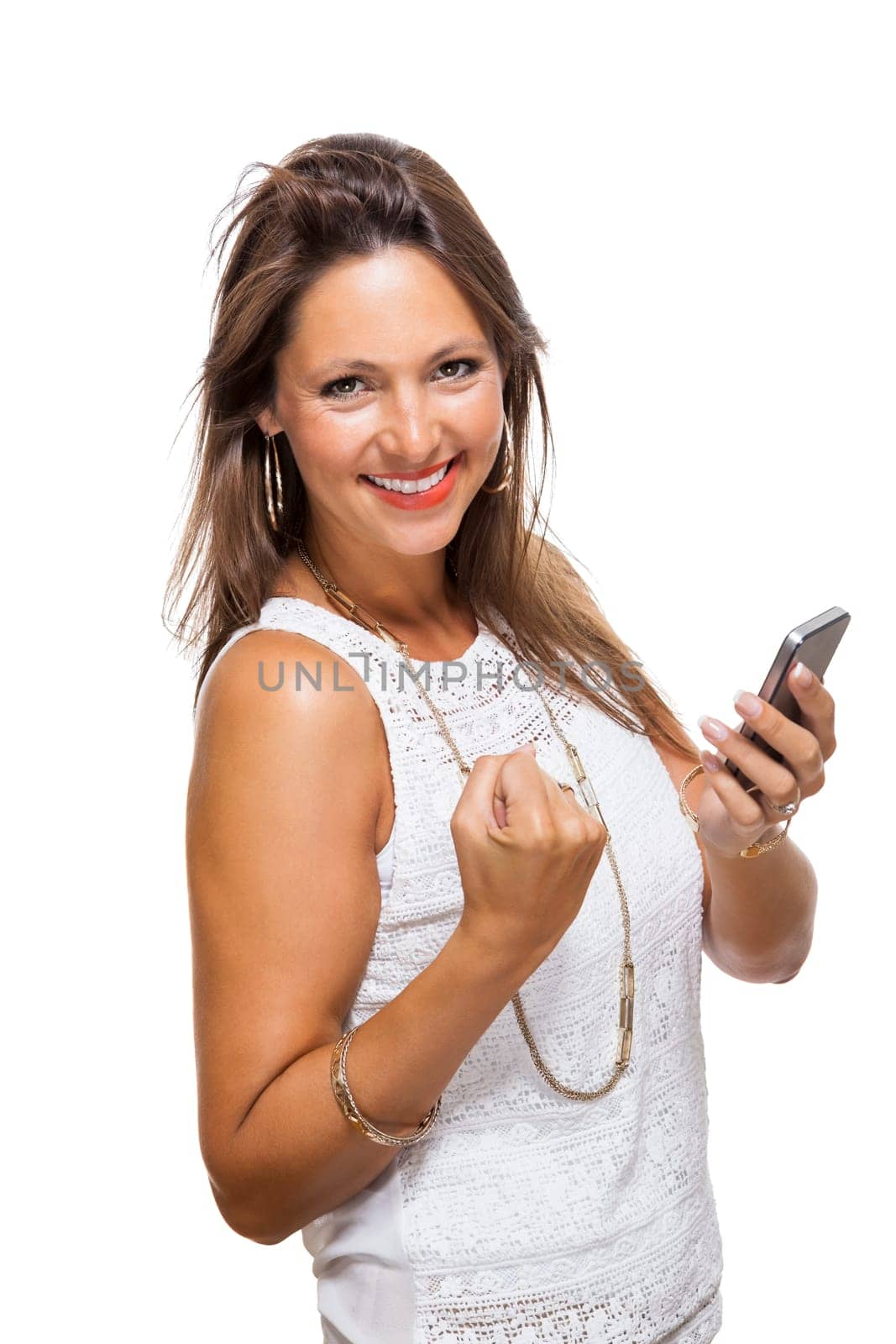 Young attractive woman reacts to a text message on her phone smartphone with open dark hair with text clearance isolated freeholder