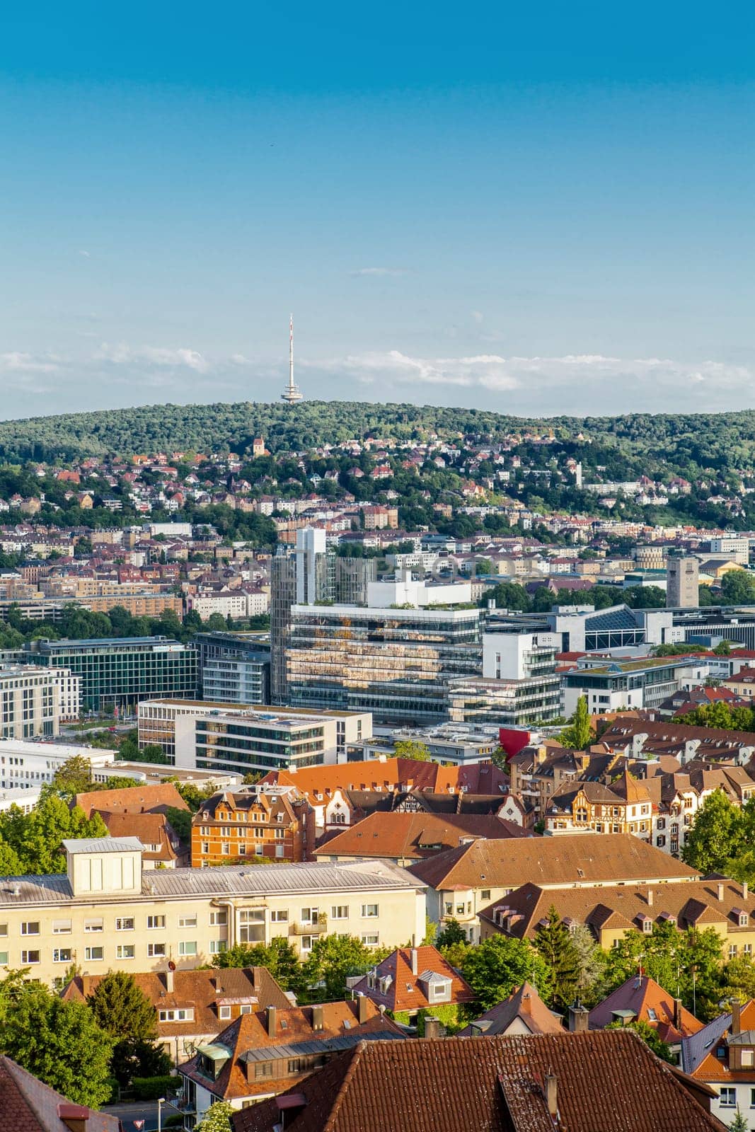 Picturesque view of Stuttgart Germany the modern skyscrapers under the traditional historical architecture overlooking the surrounding hills on a sunny day