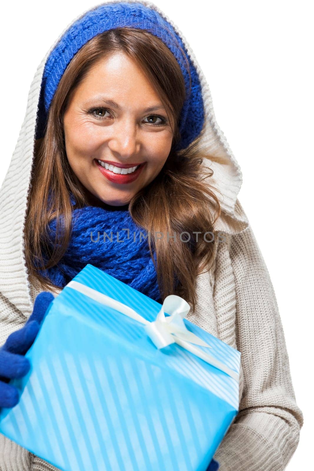 Young attractive woman with blue wool hat holds a gift for birthday Christmas in hand isolated on white background