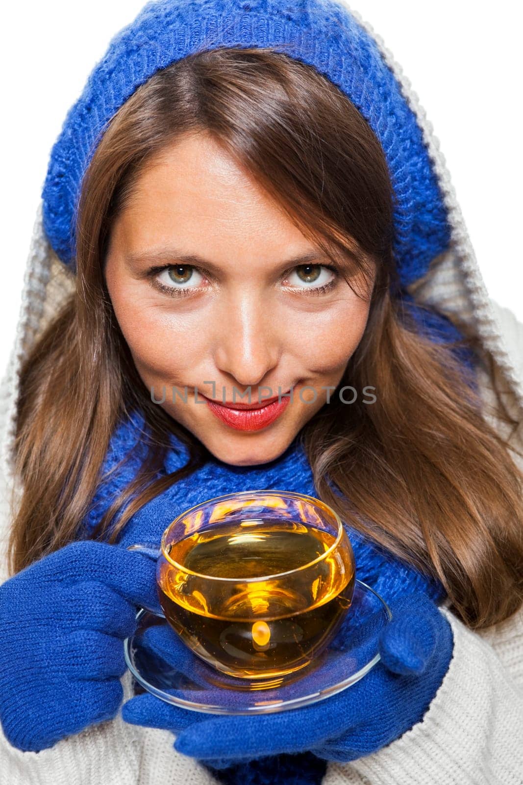 Young woman with dark hair and blue wool lyant drink a cup of tea to be isolated on white background
