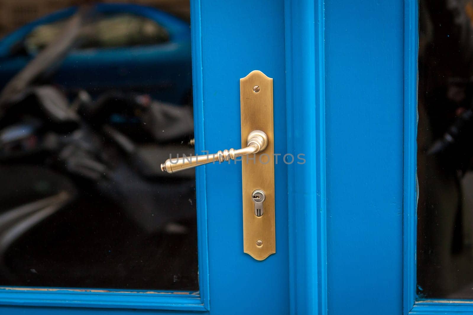 Doorknob doorknob on a wooden door entrance at a house as a close-up