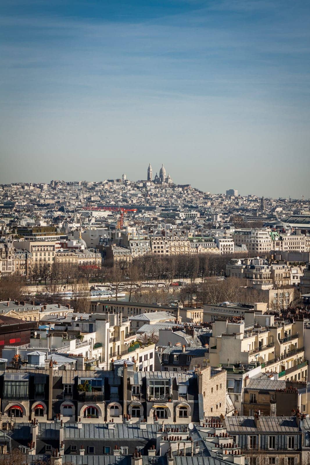 Skyline of Paris with cityscape on the Saine with blue sky in summer