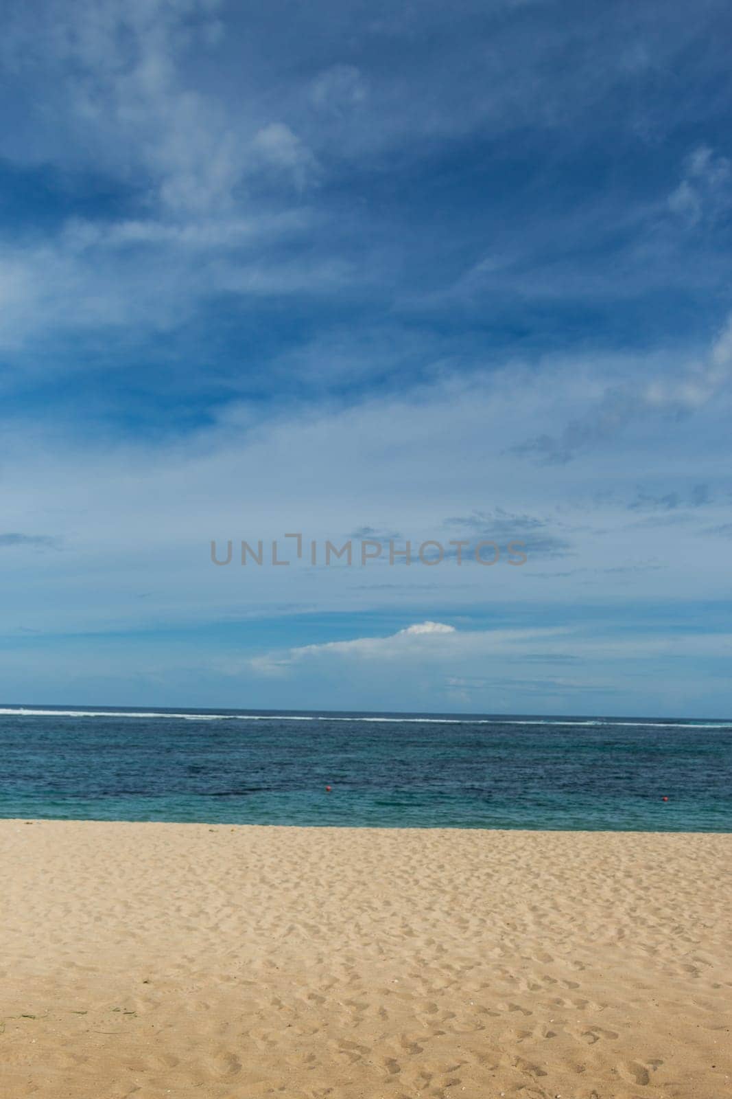 Beautiful secluded sandy beach in the Caribbean with white sand and blue sky as in paradise