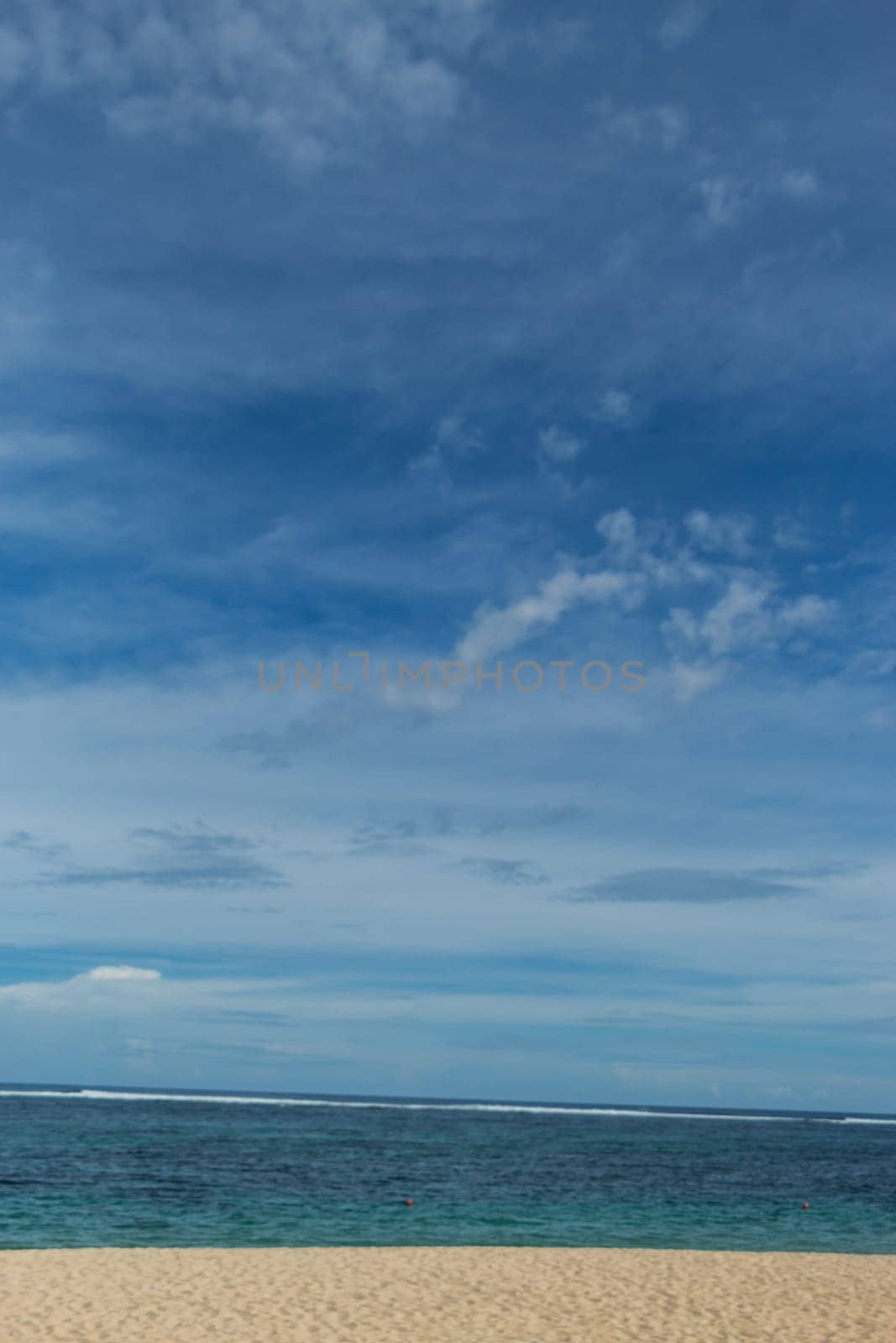 Beautiful secluded sandy beach in the Caribbean with white sand and blue sky as in paradise