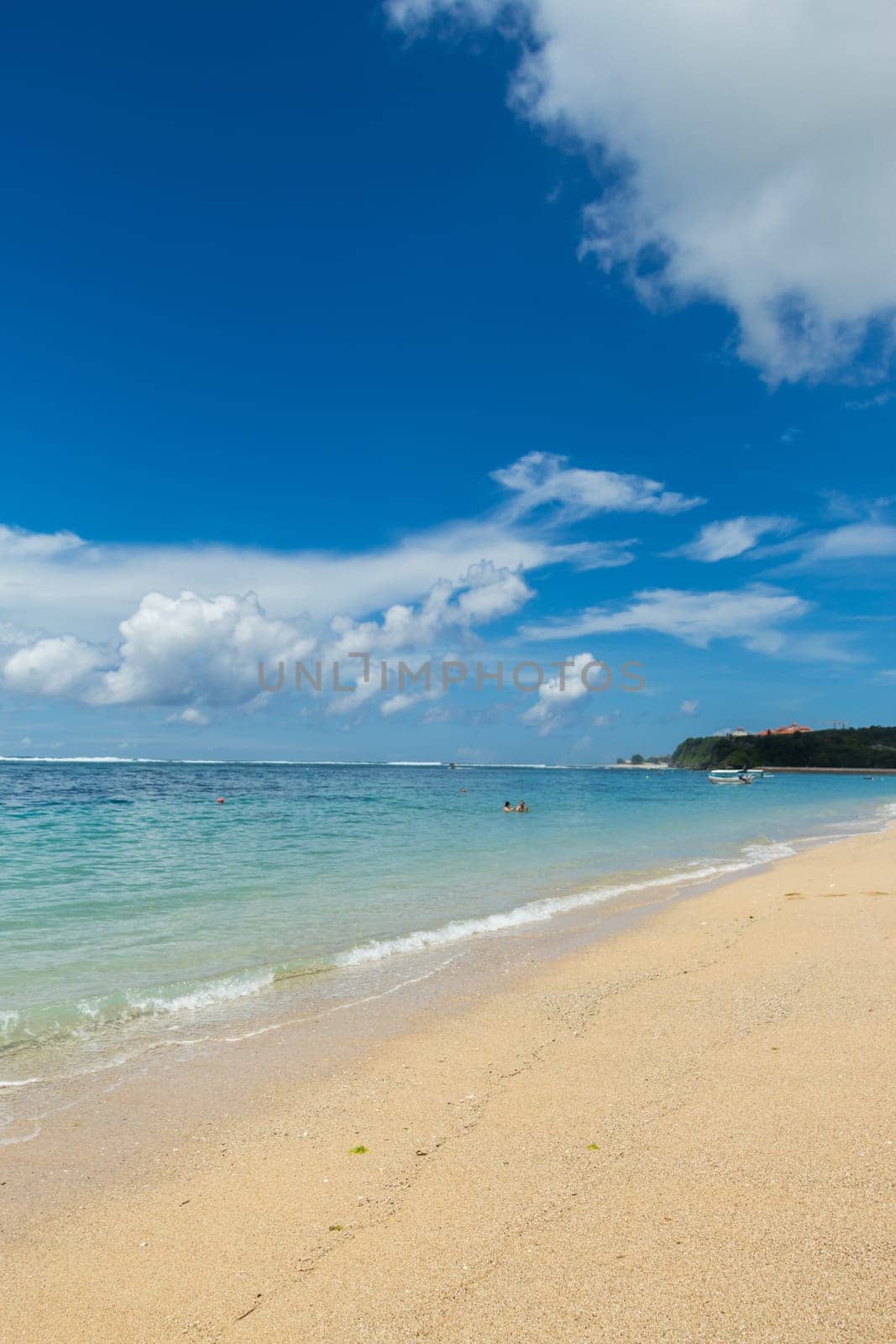 Beautiful secluded sandy beach in the Caribbean with white sand and blue sky as in paradise