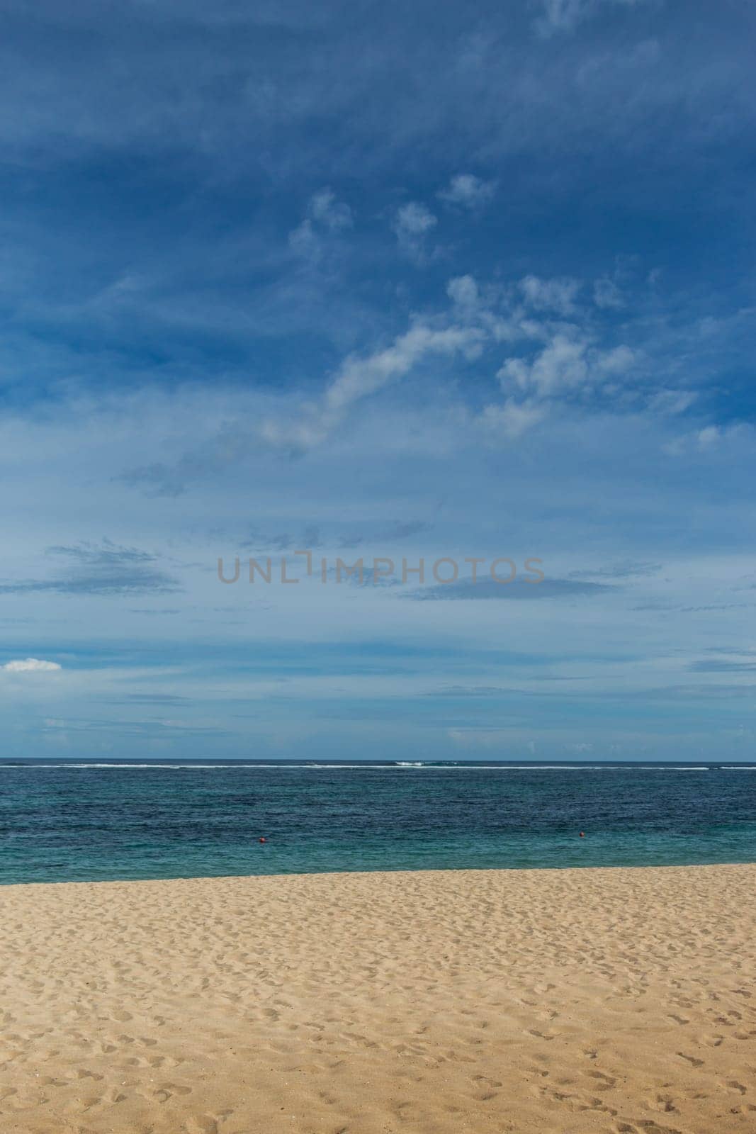 Beautiful secluded sandy beach in the Caribbean with white sand and blue sky as in paradise