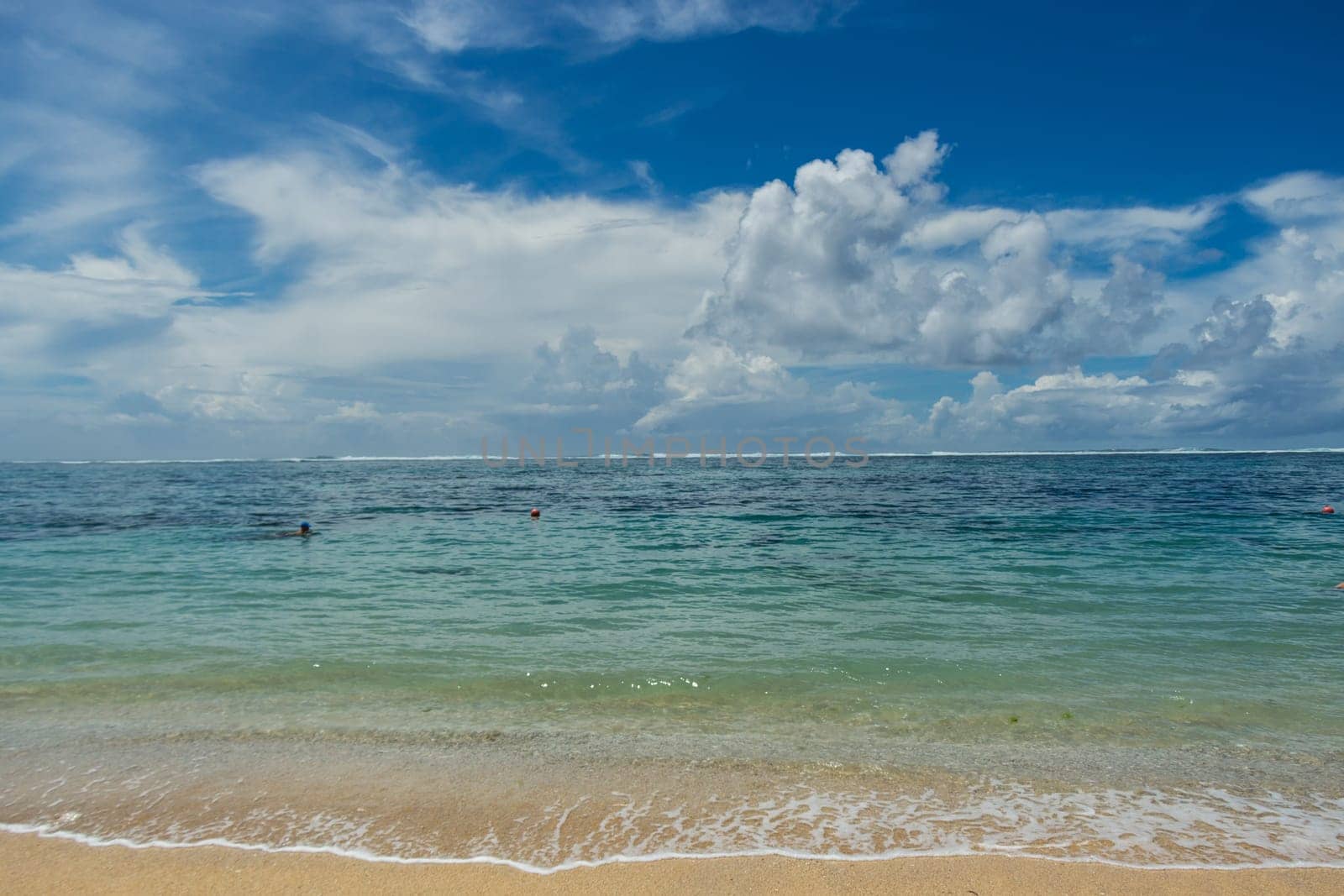 Beautiful secluded sandy beach in the Caribbean with white sand and blue sky as in paradise
