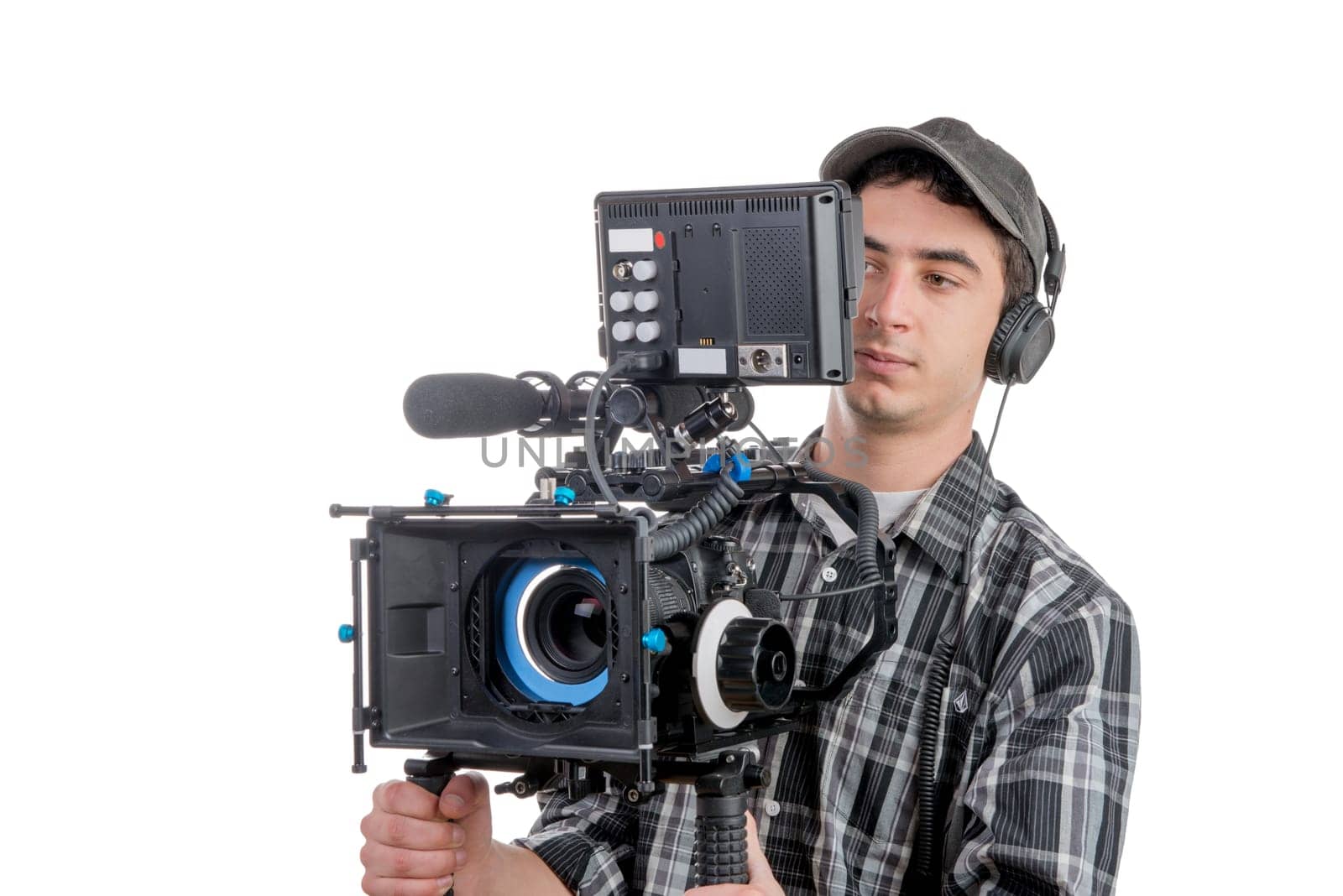 young cameraman with movie camera on the white background