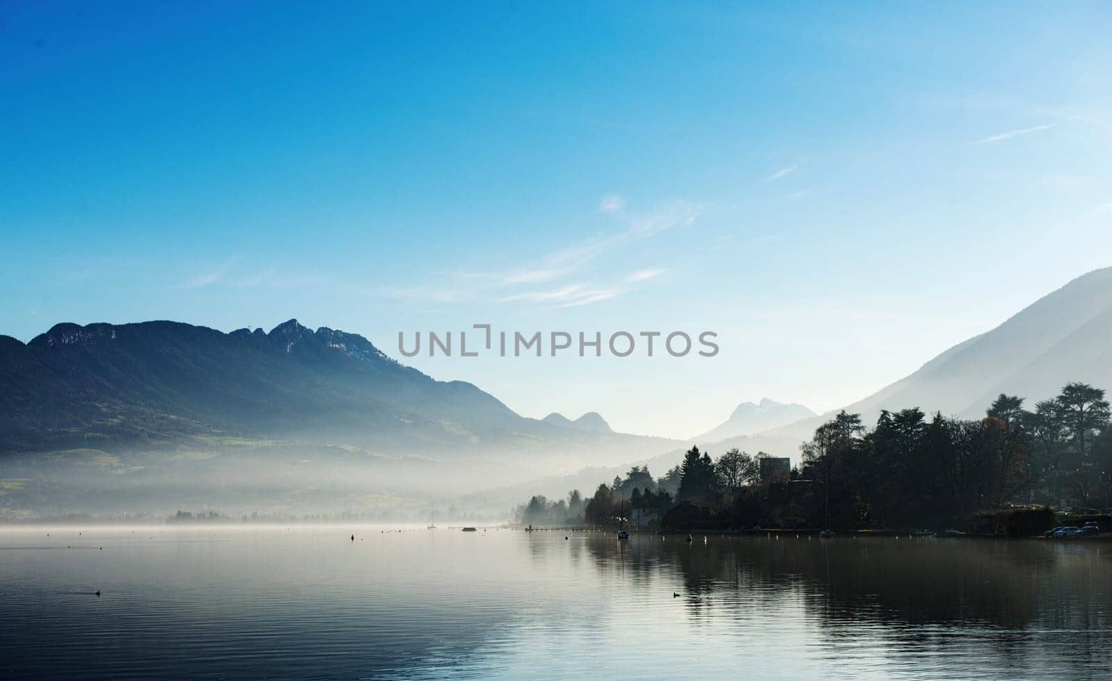 Lake Annecy in France in autumn at sunset