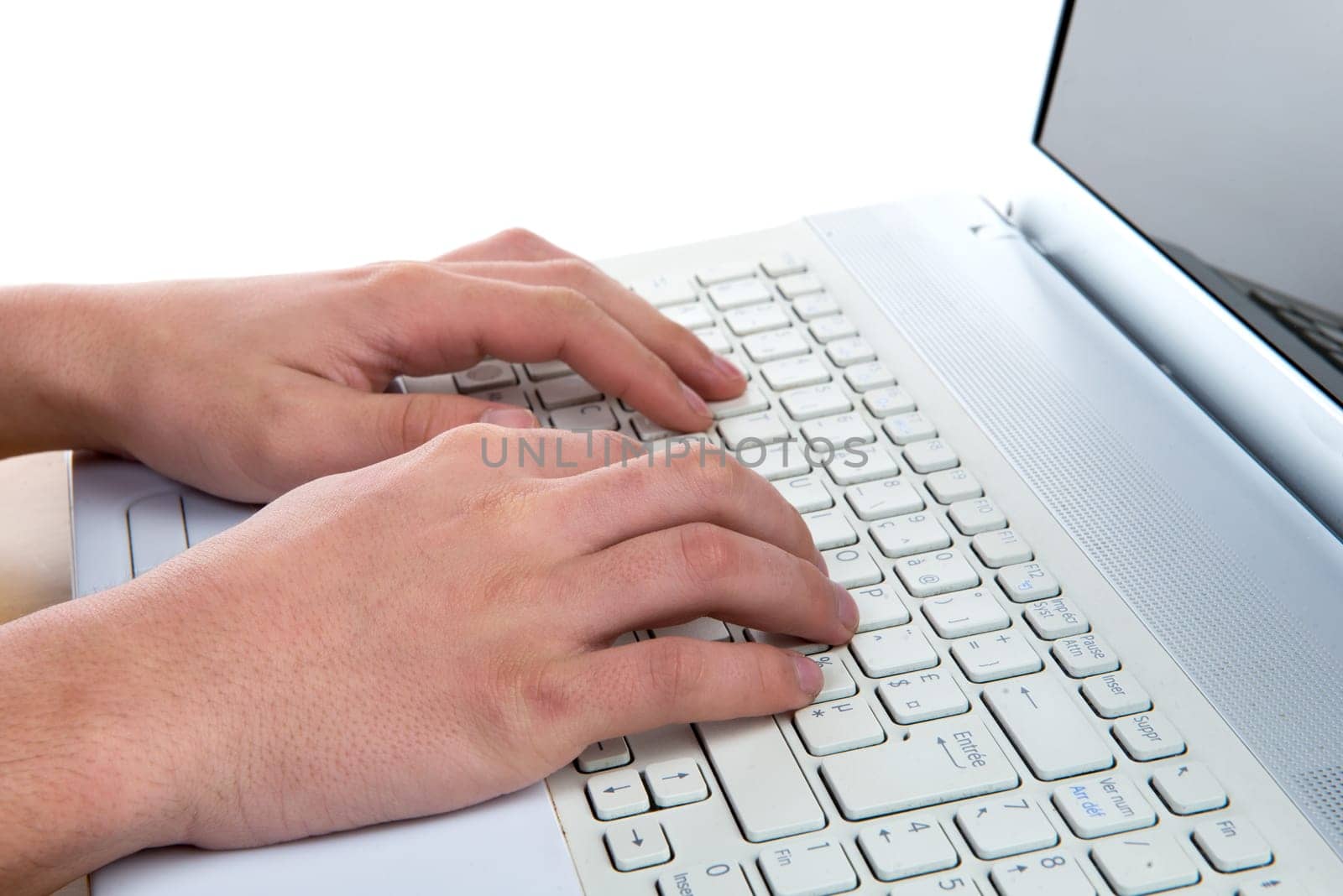 close up of a man's hands to the white computer