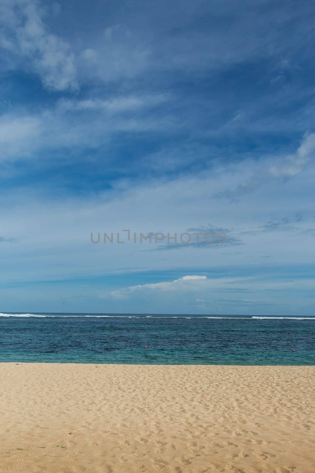 Beautiful secluded sandy beach in the Caribbean with white sand and blue sky as in paradise
