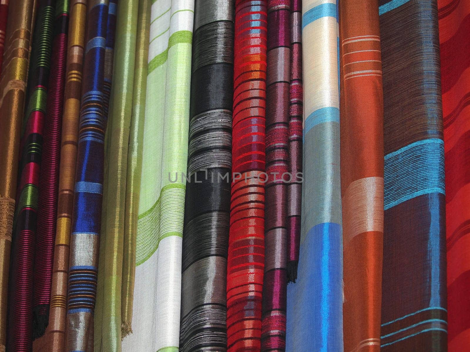 Pile of gentle folded shawls (scarfs) at the market
