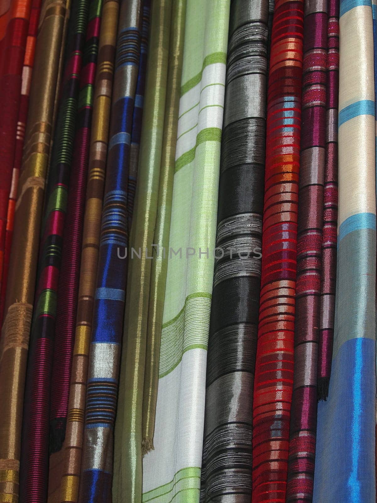 Pile of gentle folded shawls (scarfs) at the market