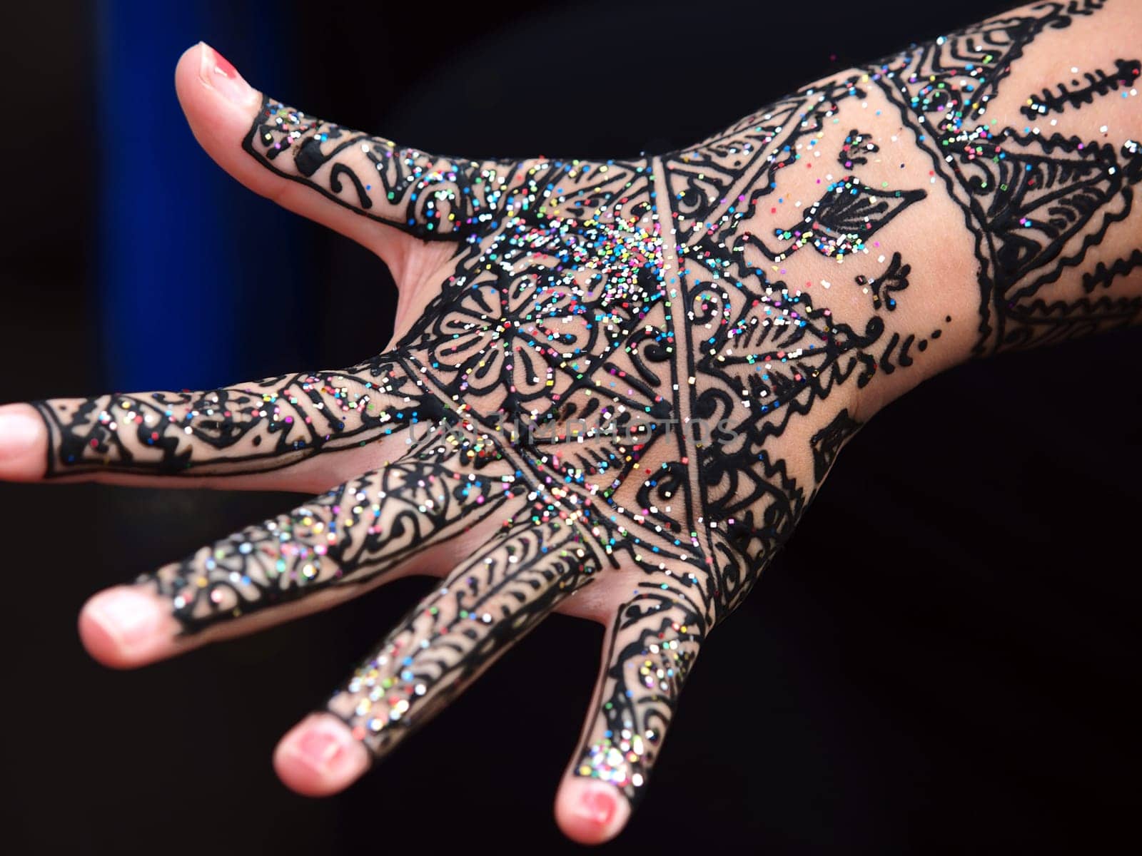 image showing isolated hand of an Indian bride with herbal heena.