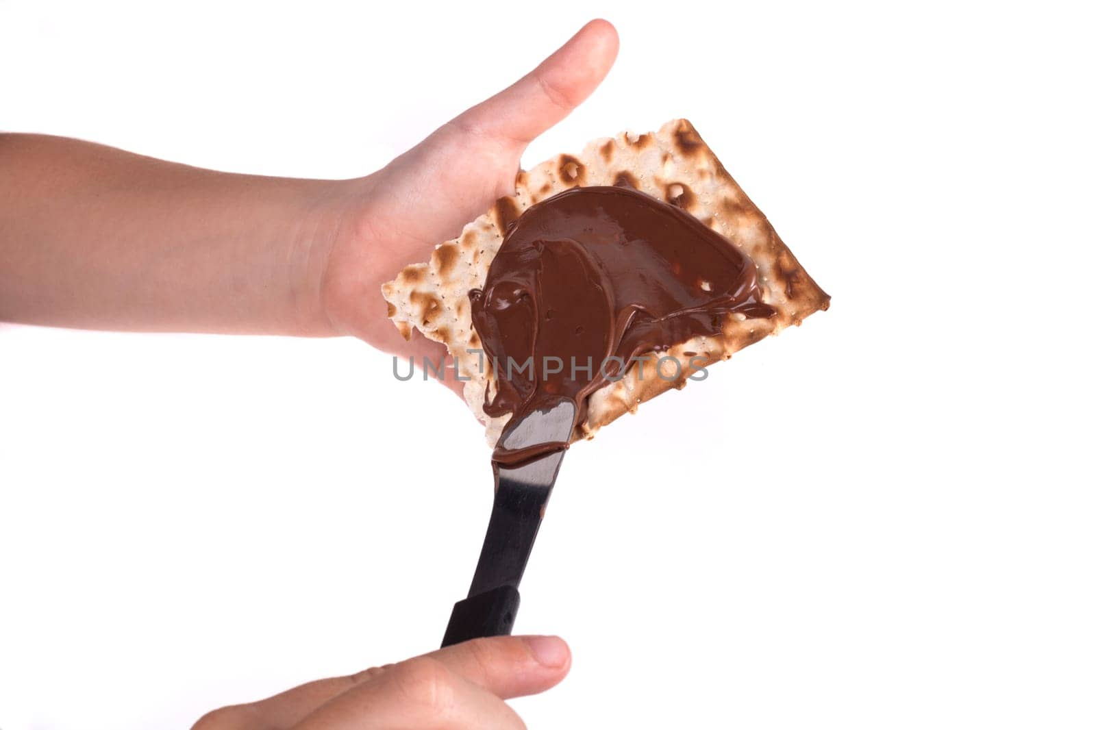 Child Hand Making Passover Sweets Isolated on White