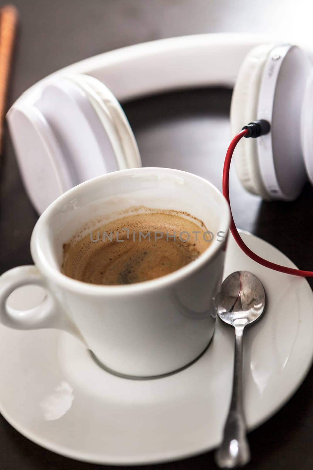 A white cup filled with delicious coffee
