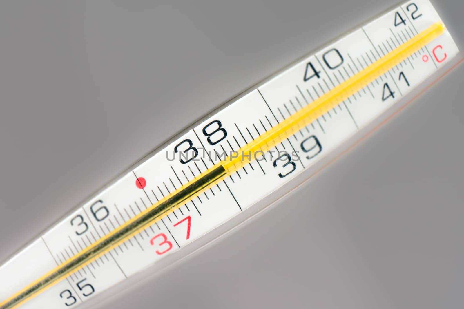 Thermometer shows 38 Celsius, sick temperature, fever.