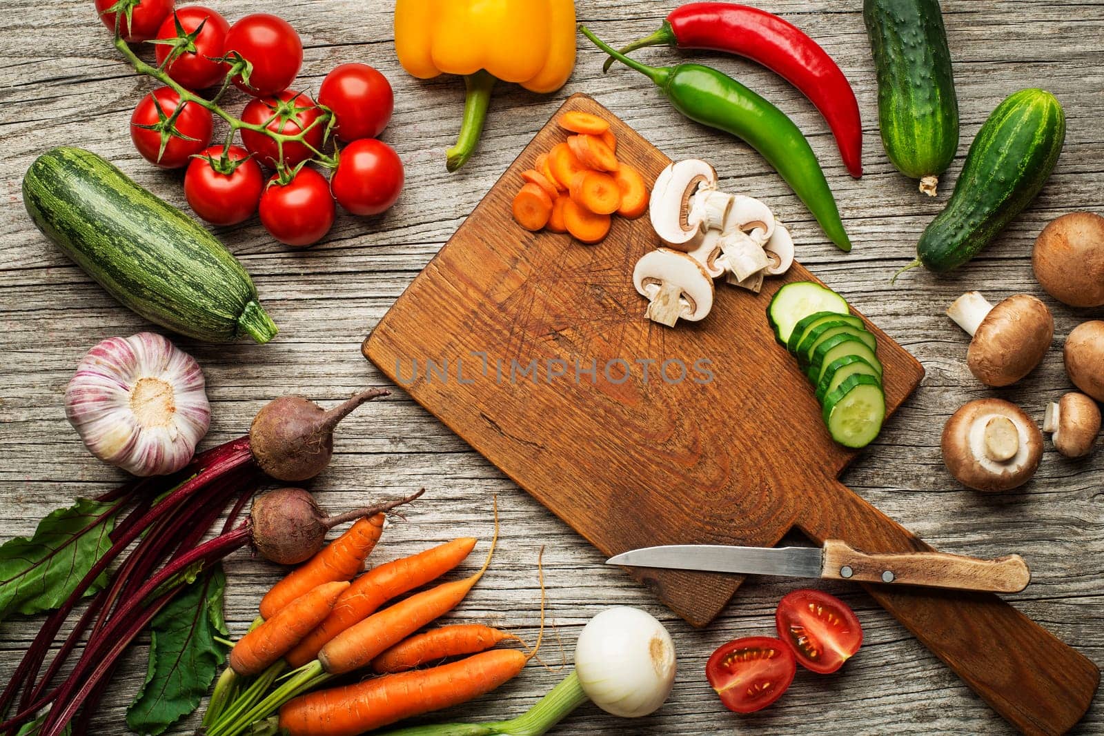 Various fresh vegetables and ingredients on wooden rustic background