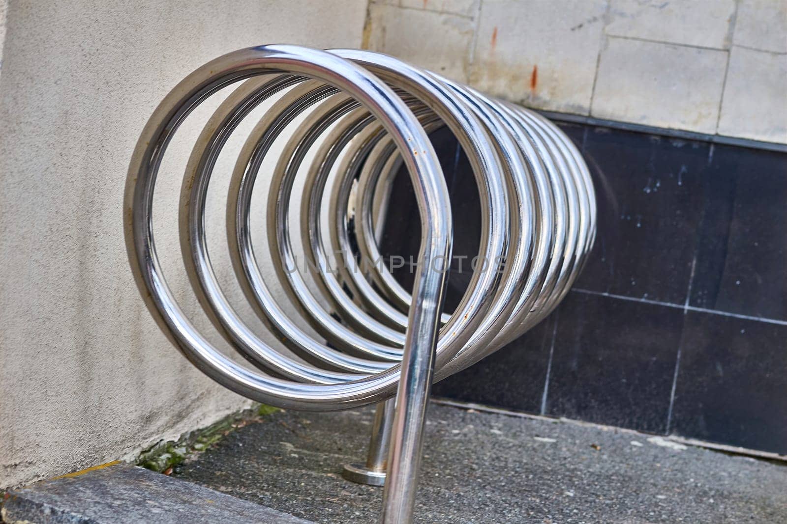 winding in a continuous and gradually widening or tightening curve