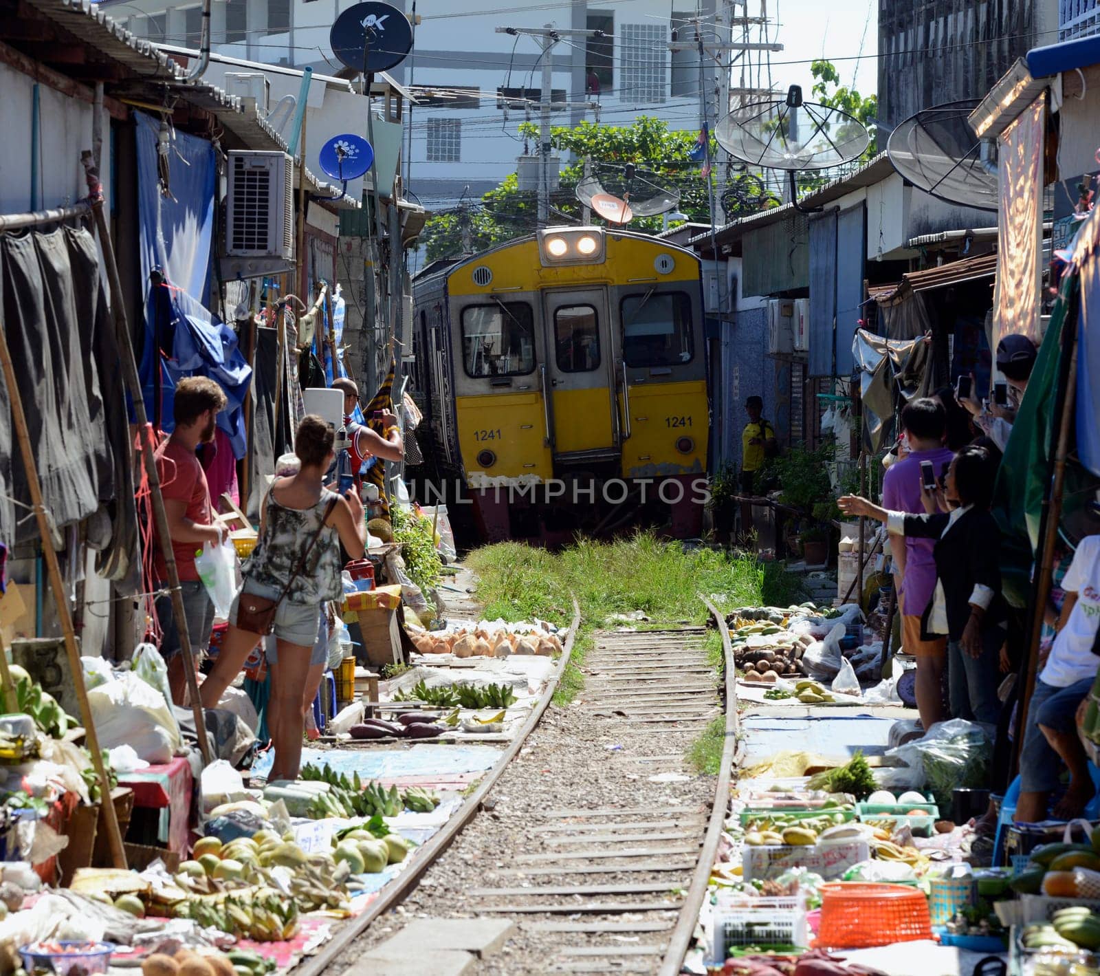 The Maeklong Railway Market at Maeklong Station south-west of Bangkok in Thailand in South East Asia.