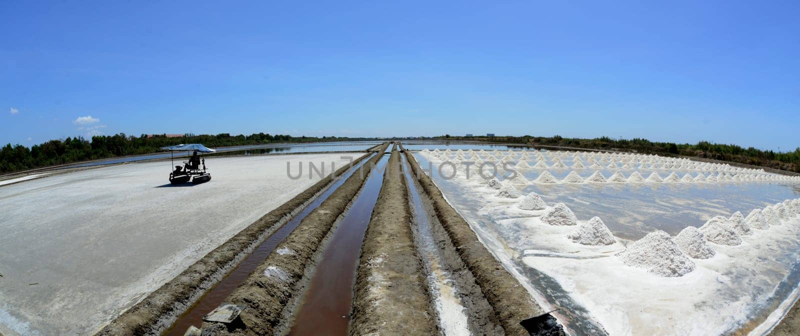A salt field for the extraction of sea salt south-west of the city of Bangkok in Thailand in South East Asia.