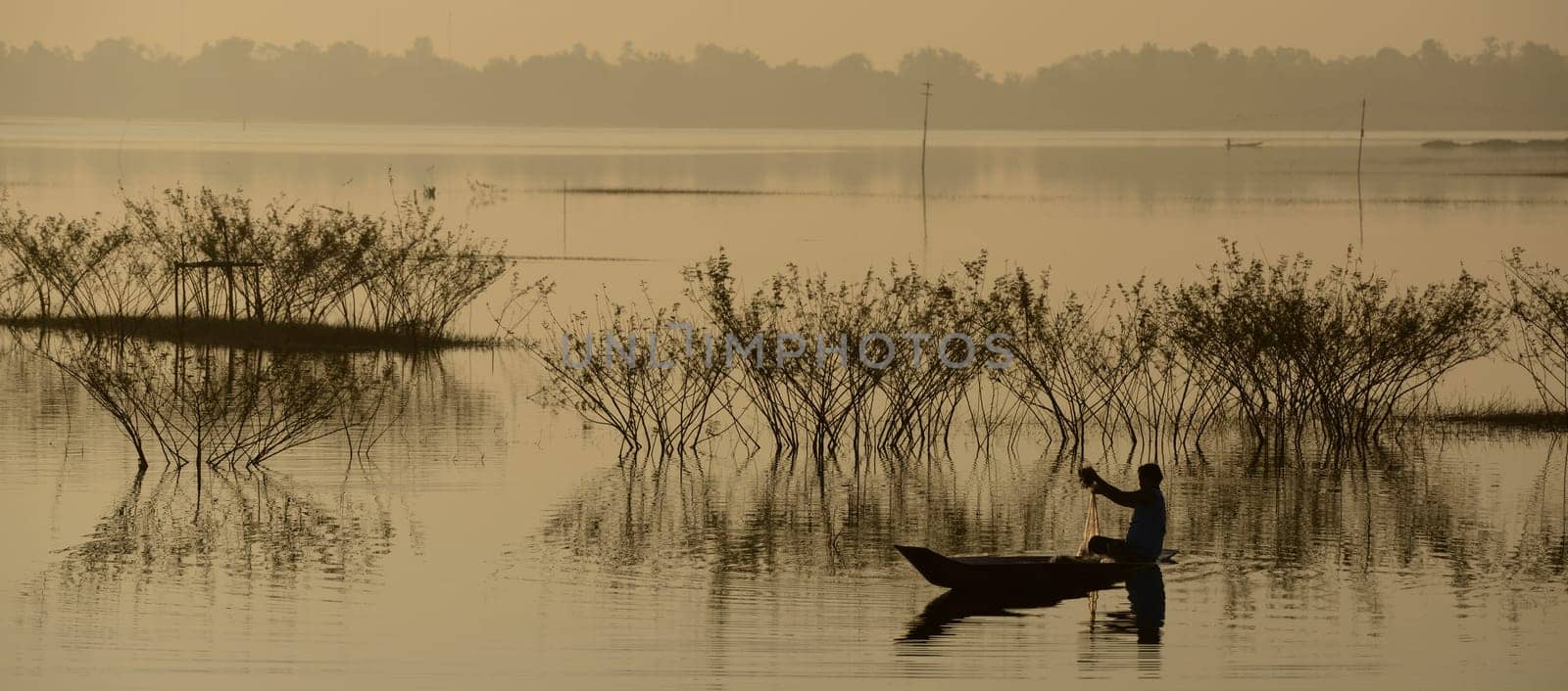 A fisherman on the lake in Amnat Charoen in the Isan in eastern Thailand
