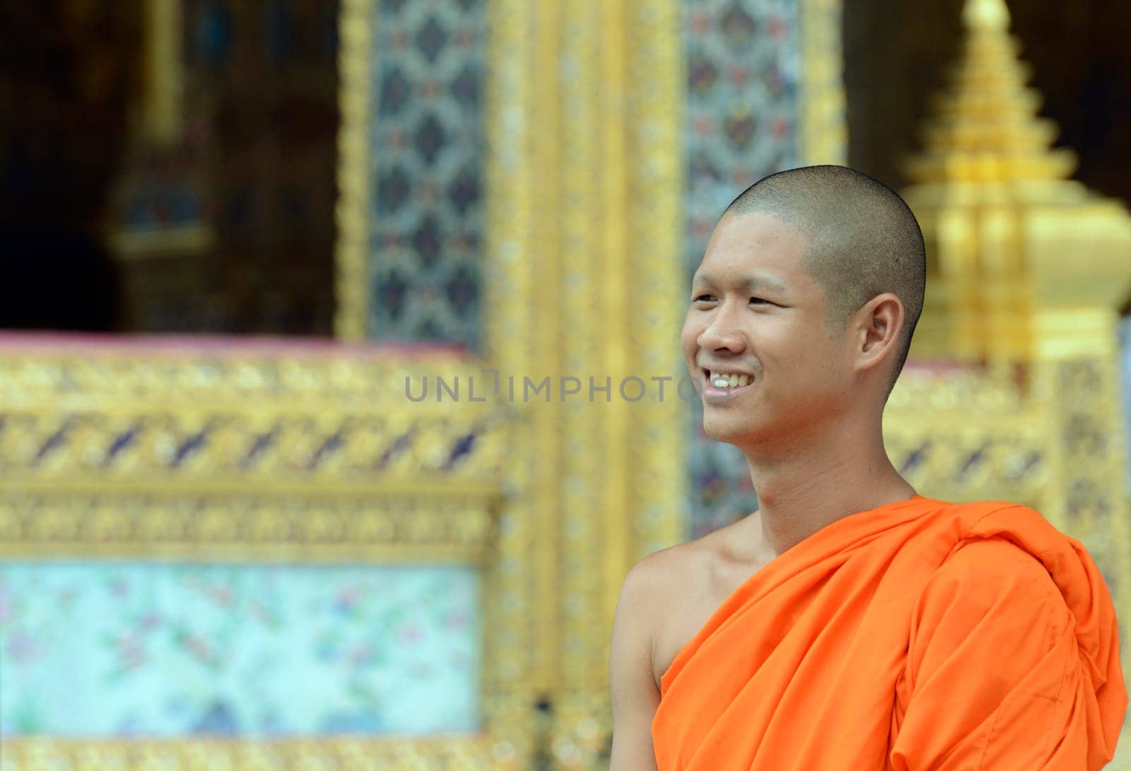 A moench in the temple complex of Wat Phra Kaew in the capital Bangkok of Thailand in South East Asia.